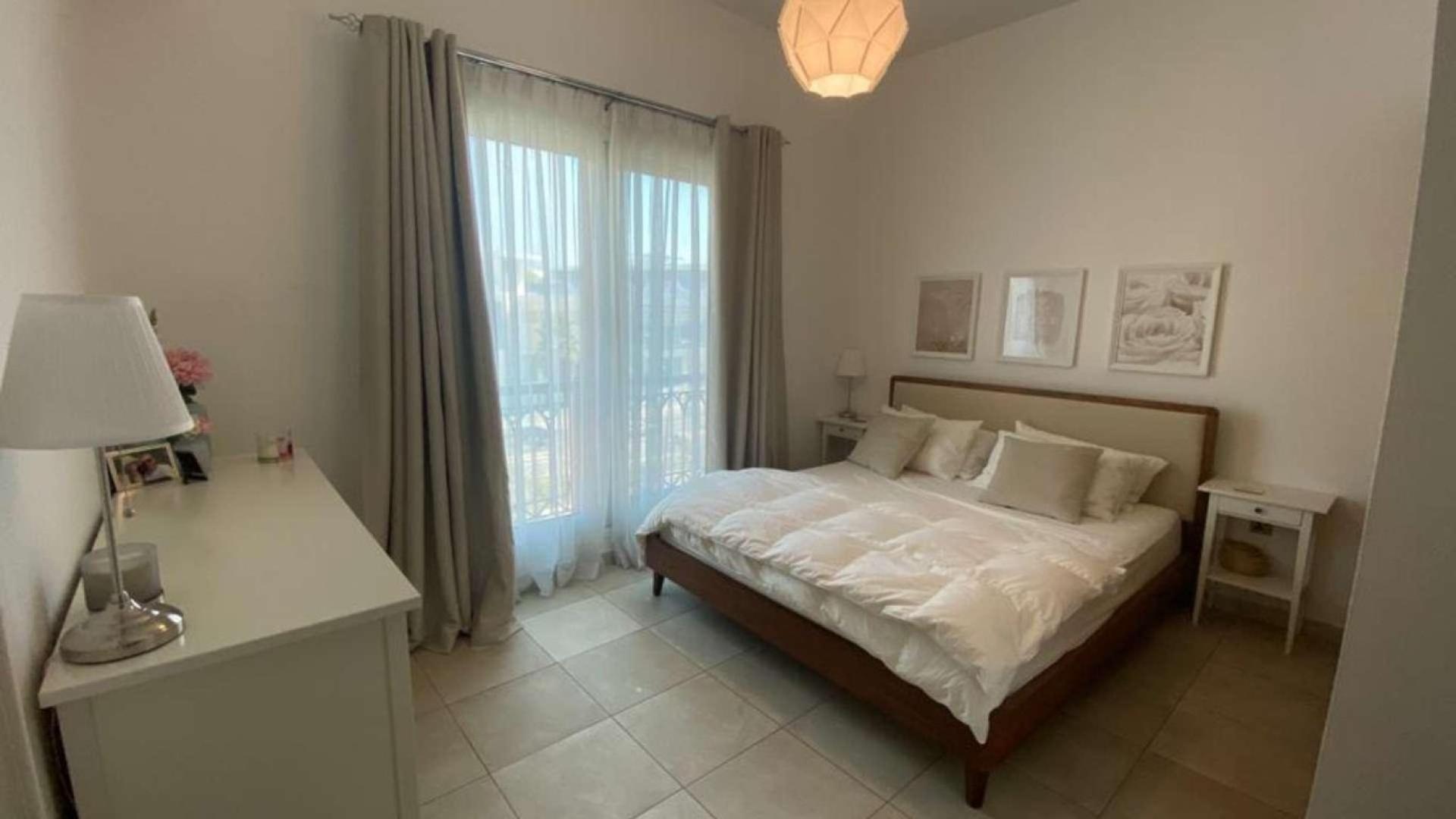 Balcony view of pool and greenery in Marina Residences, Palm Jumeirah apartment for rent