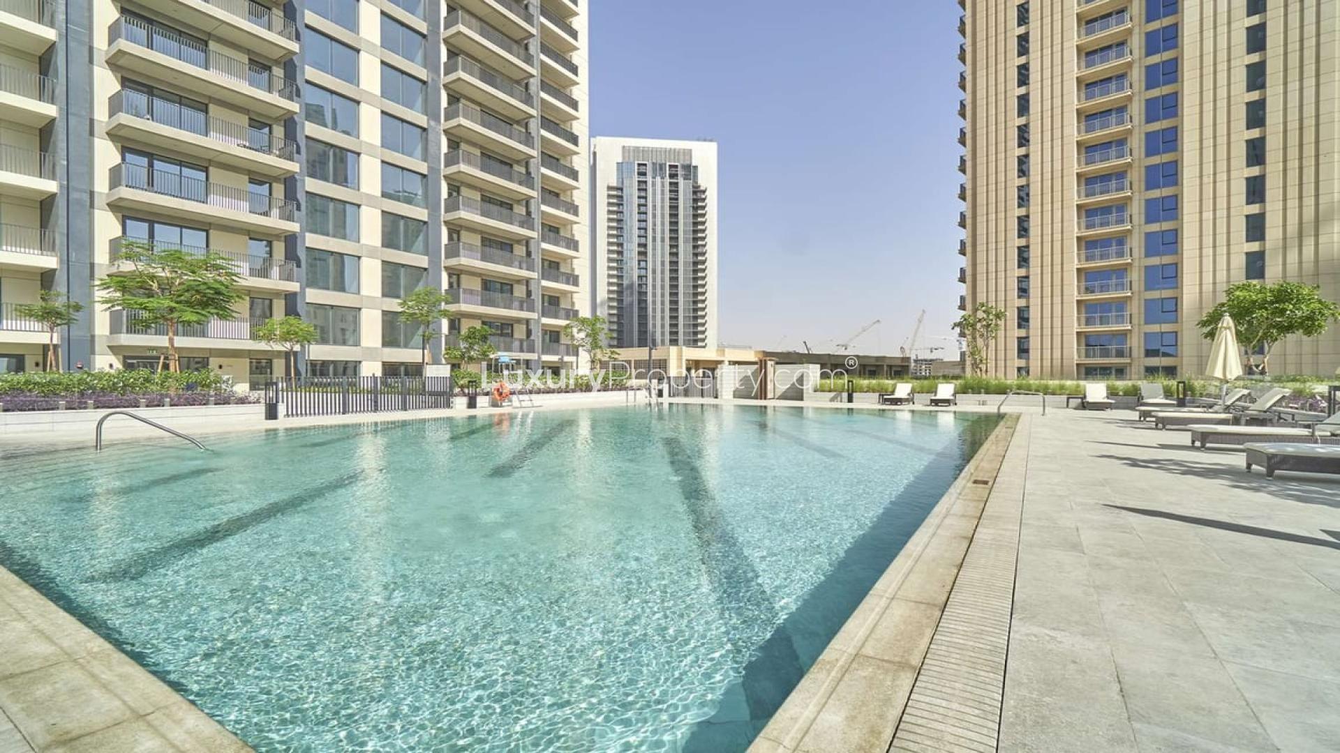 "Spacious living area in one-bedroom apartment for rent, Dubai Creek Harbour, Creek Horizon.",Outdoor pool area at Creek Horizon, Dubai Creek Harbour apartment for rent, LP07915