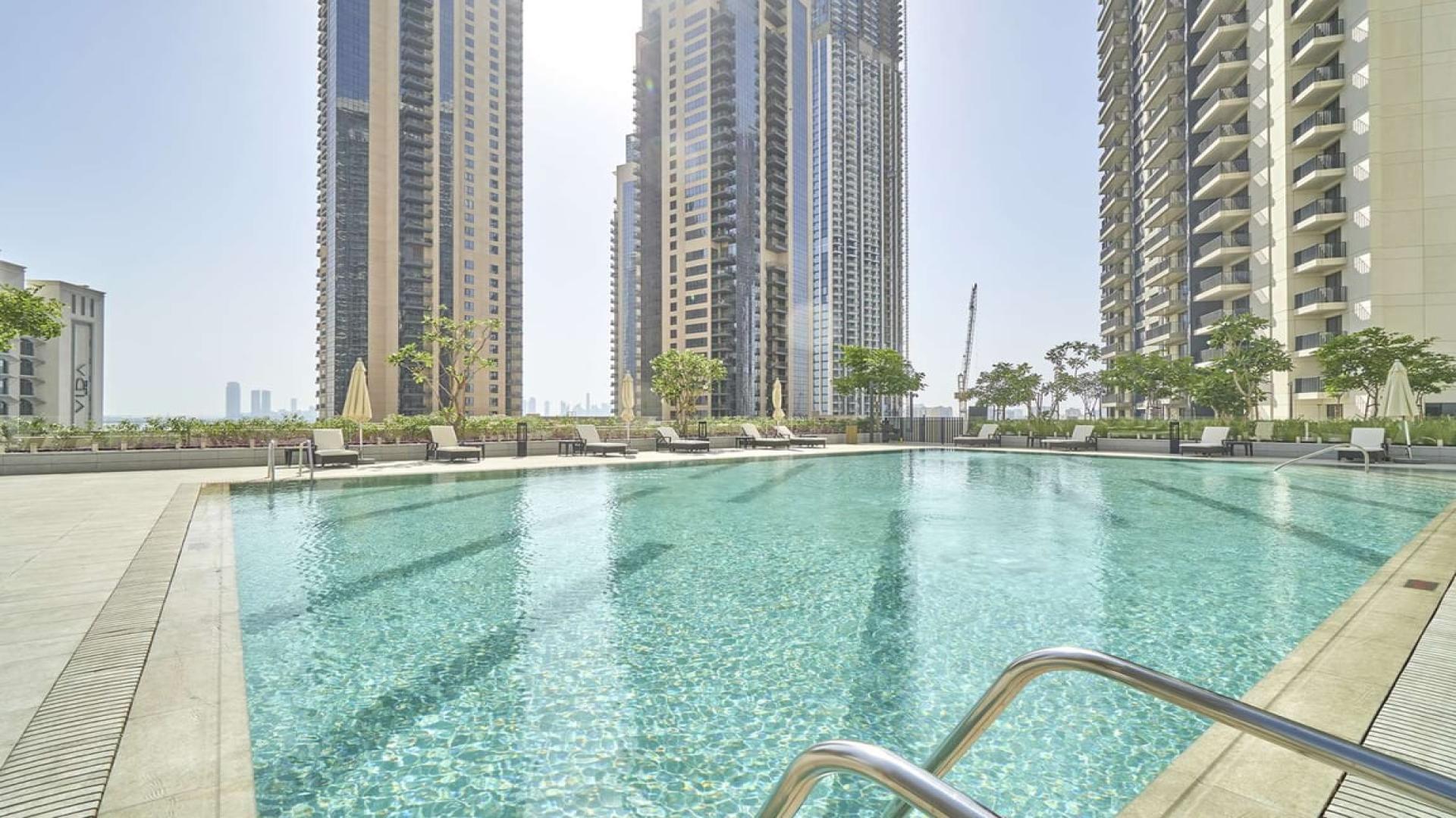 Luxurious open-plan kitchen and living area in Dubai Creek Harbour apartment for rent