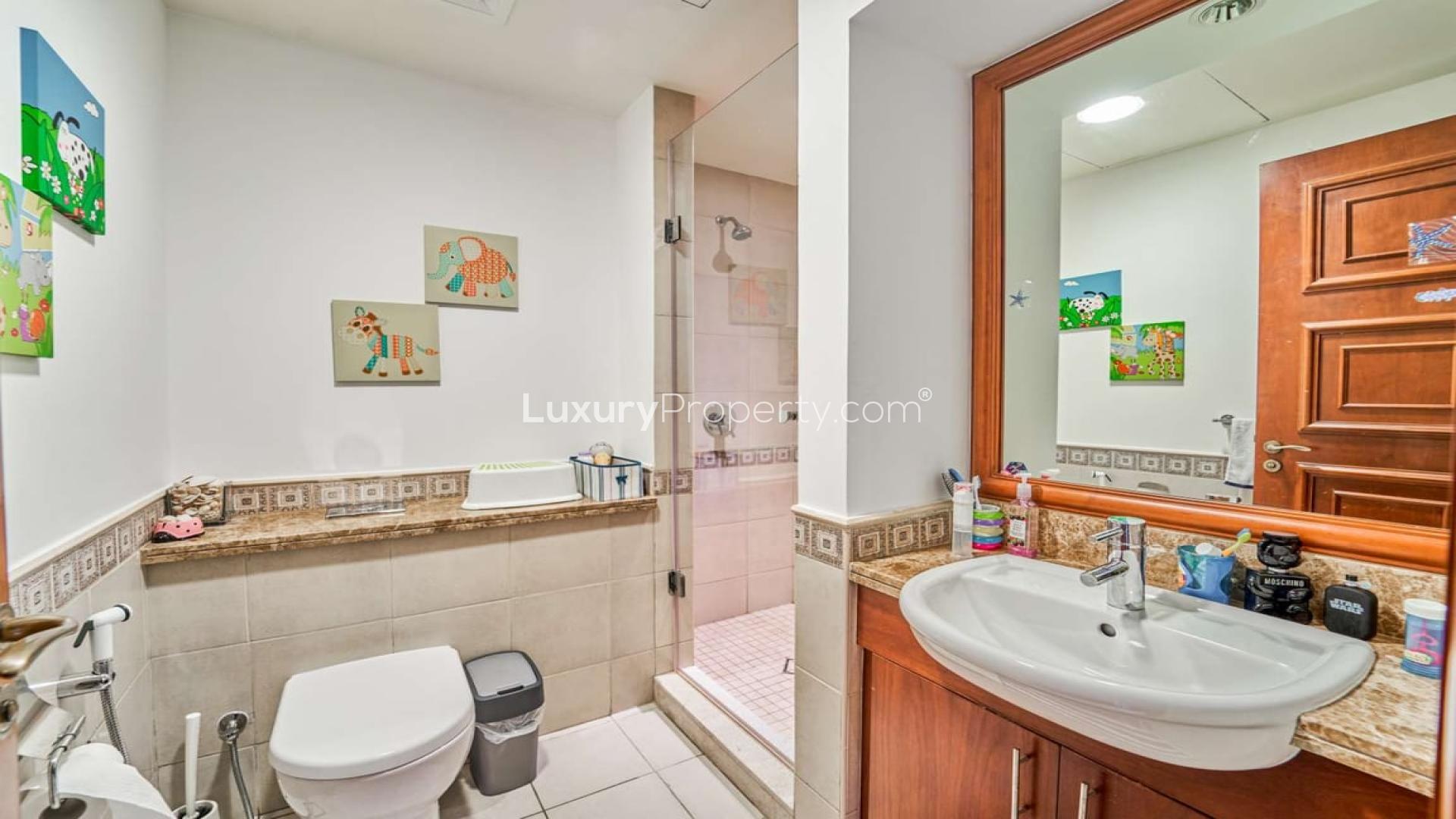 Bathroom in well-maintained 2-bedroom apartment, Golden Mile, Palm Jumeirah. Features shower and decor