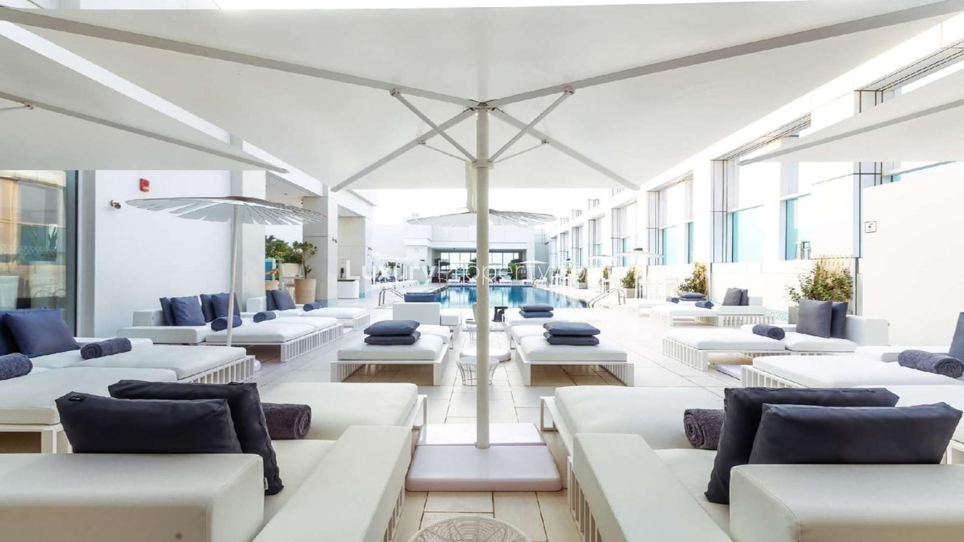 Luxury rooftop pool area at Sheraton Grand Hotel apartment, Sheikh Zayed Road, Dubai