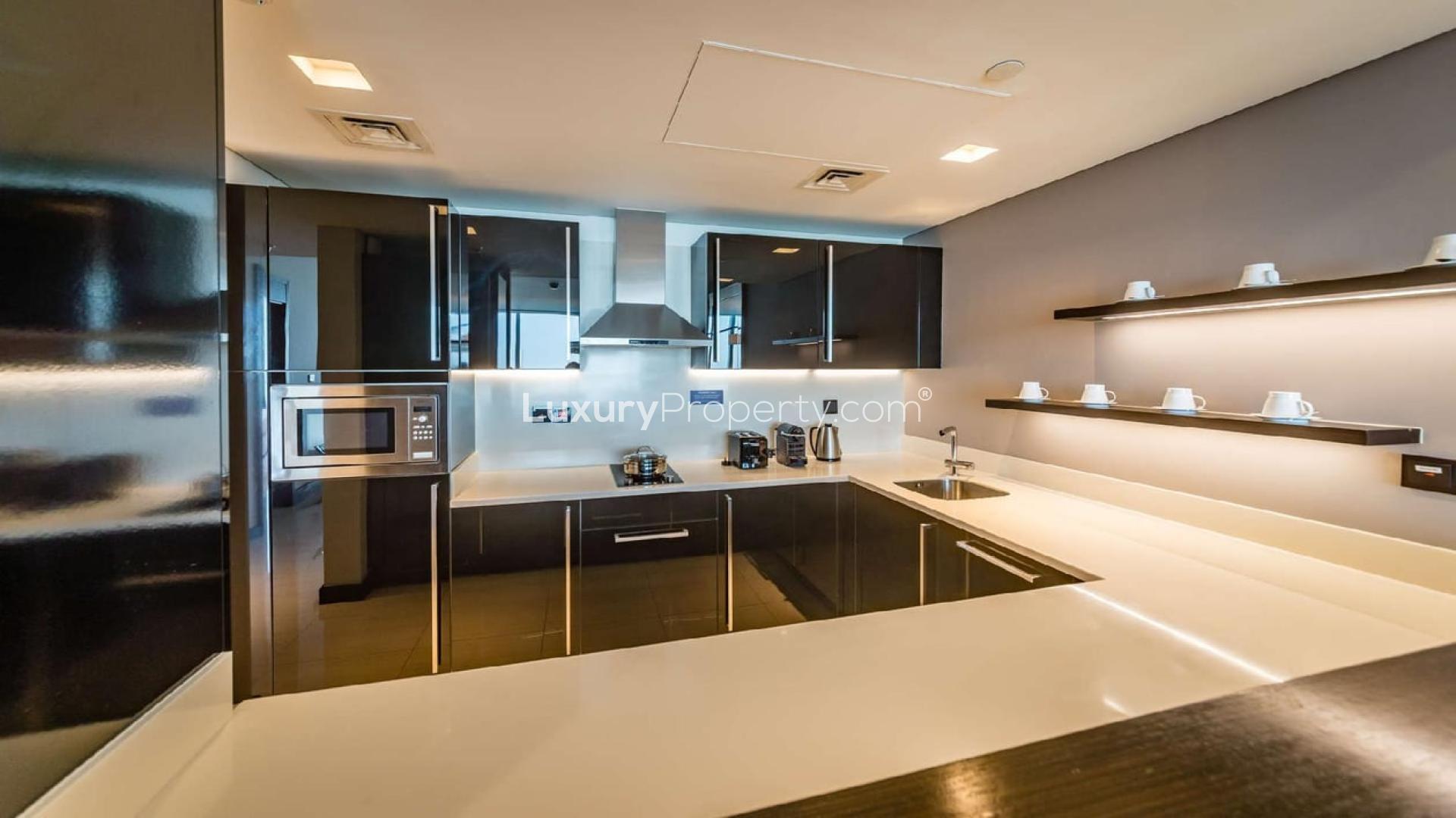Modern living area in Sheraton Grand Hotel apartment, Sheikh Zayed Road, with sleek kitchen design