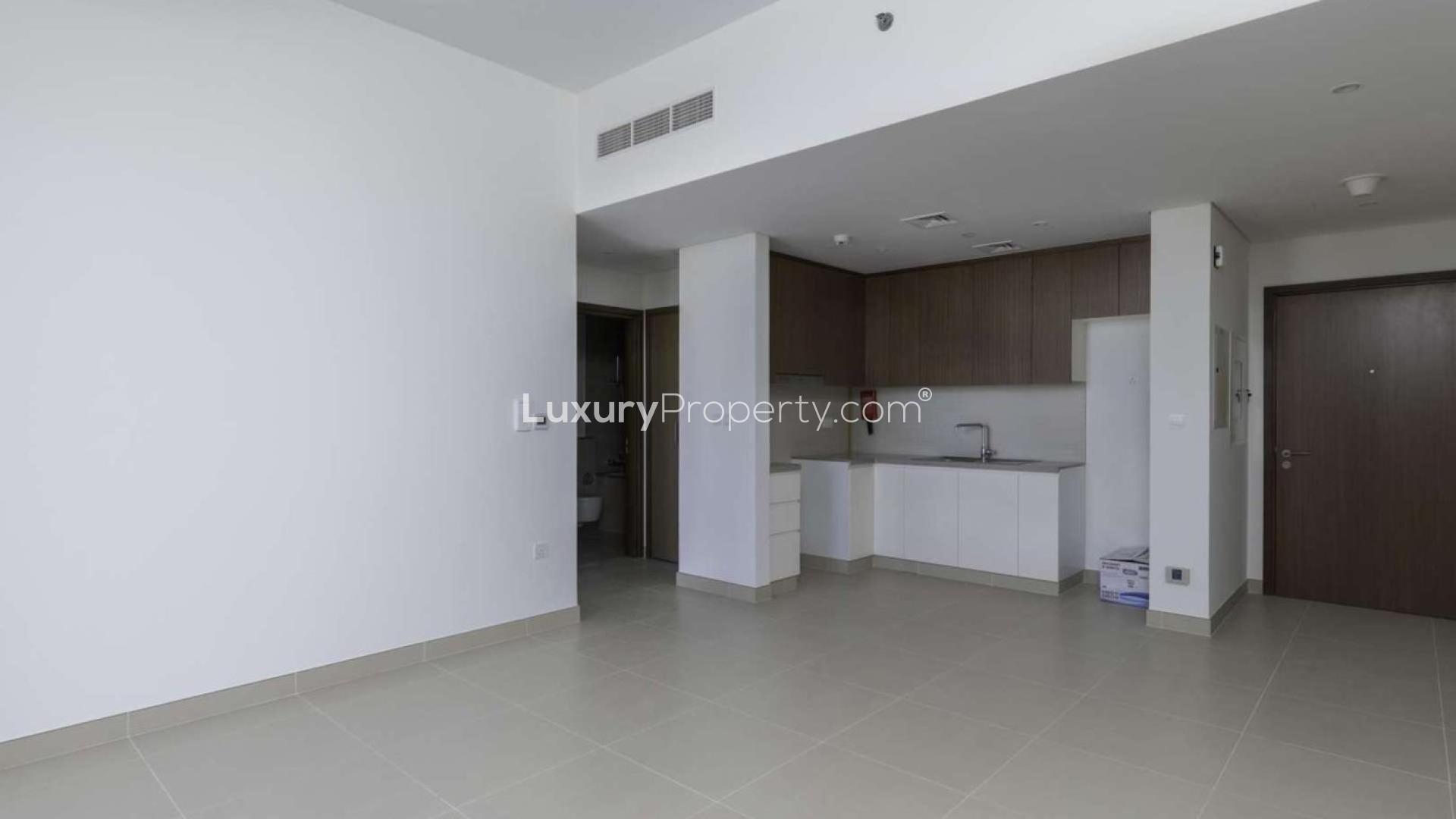 Empty room with large windows and balcony view in Dubai Marina apartment