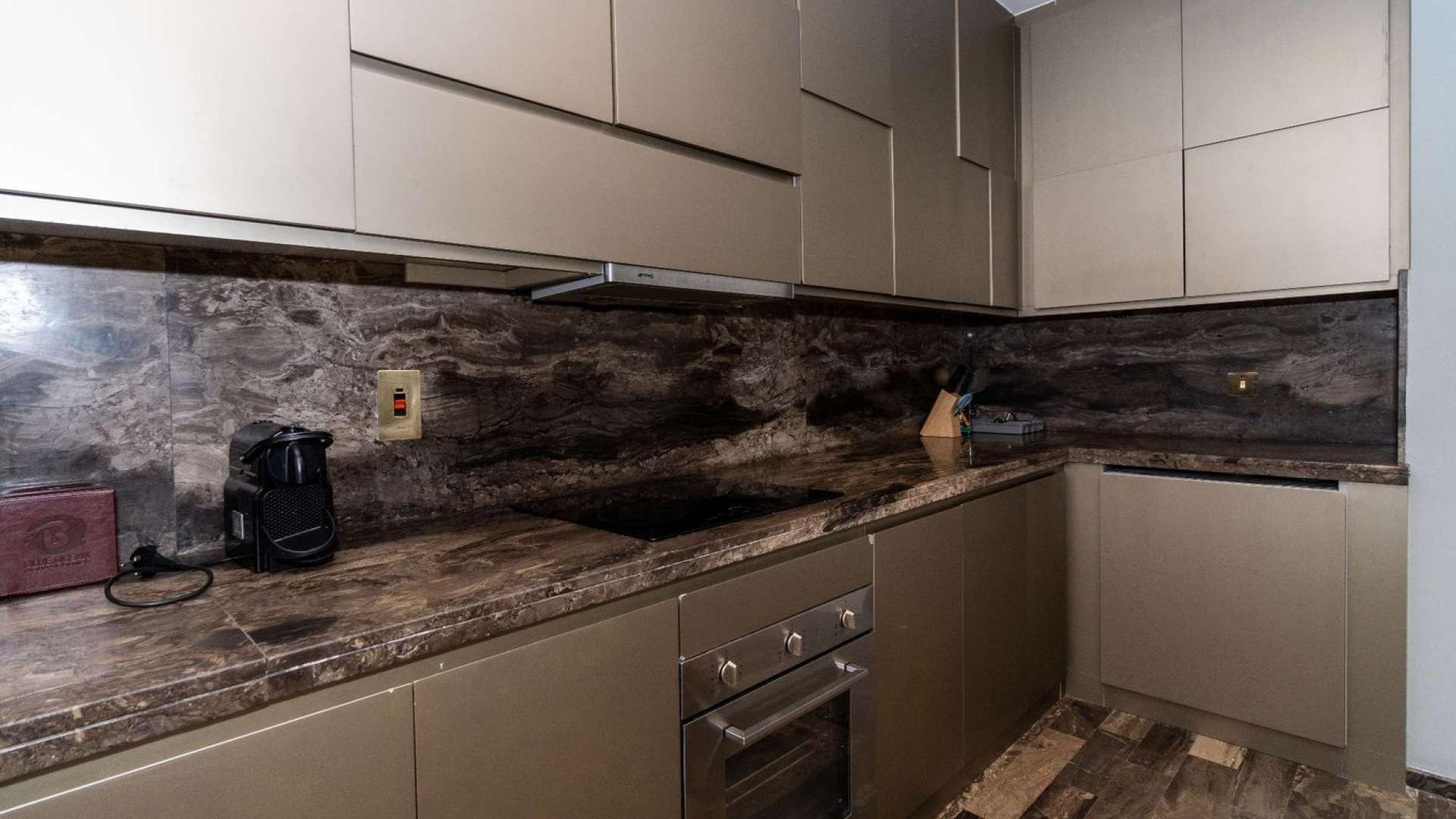 Balcony view from Fendi styled apartment in Damac Heights, Dubai Marina, with cityscape