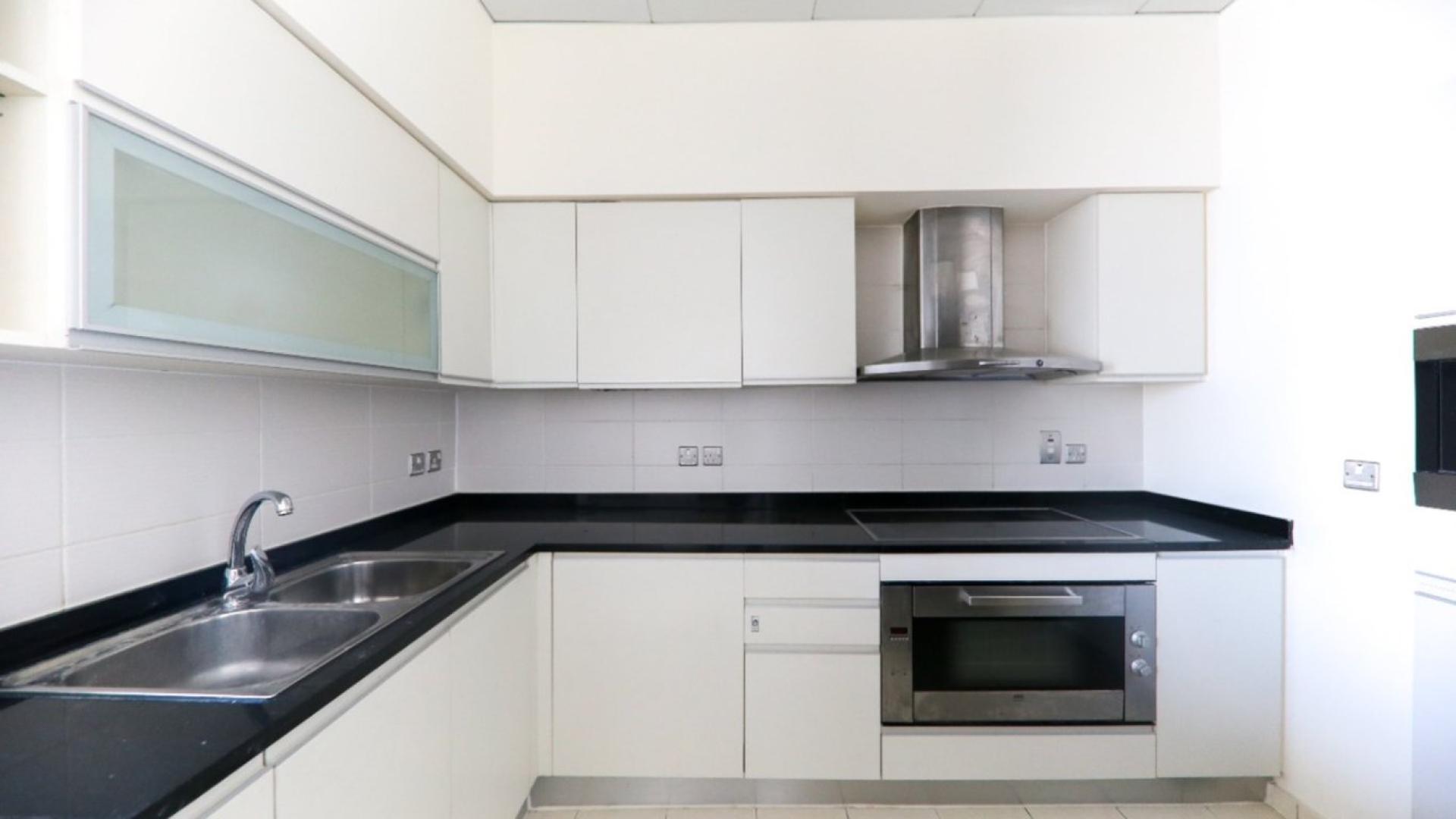 Bright living area with large windows in Palm Jumeirah apartment for rent