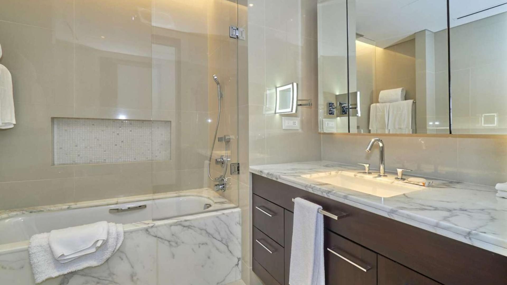 Modern bathroom with marble countertops in The Address Sky View, Downtown Dubai apartment for rent