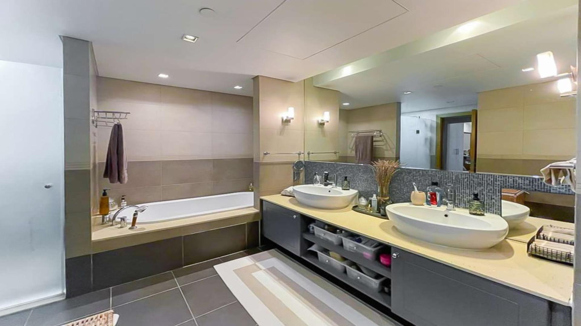 Upgraded kitchen in Marina Residences apartment, Palm Jumeirah, with modern appliances and sleek design