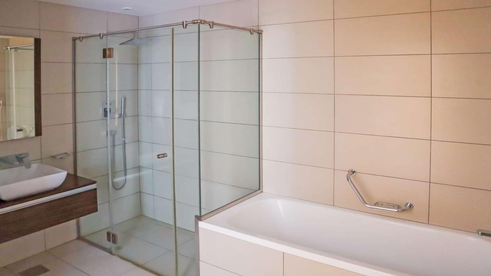 Open plan kitchen and living area in Ariyana Tower apartment, Dubai Marina for rent