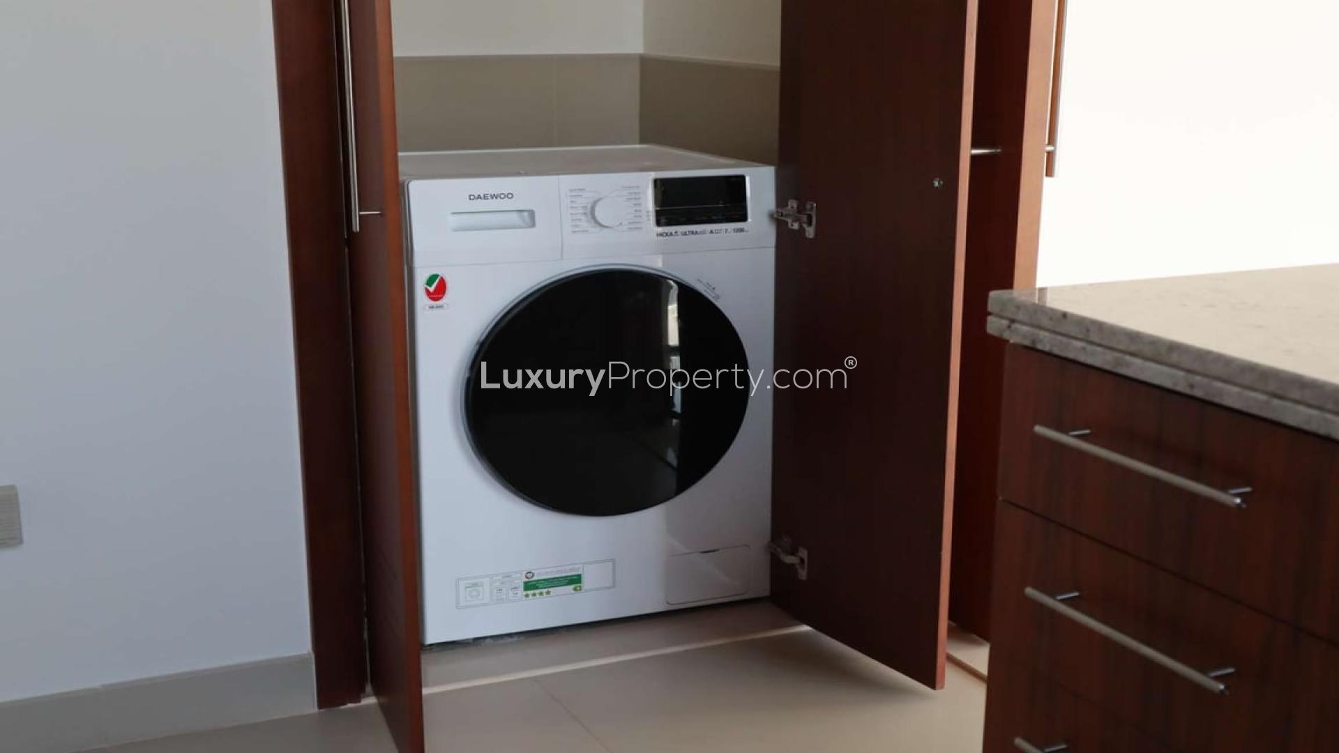 Empty apartment with large windows showcasing Burj Khalifa views in Downtown Dubai