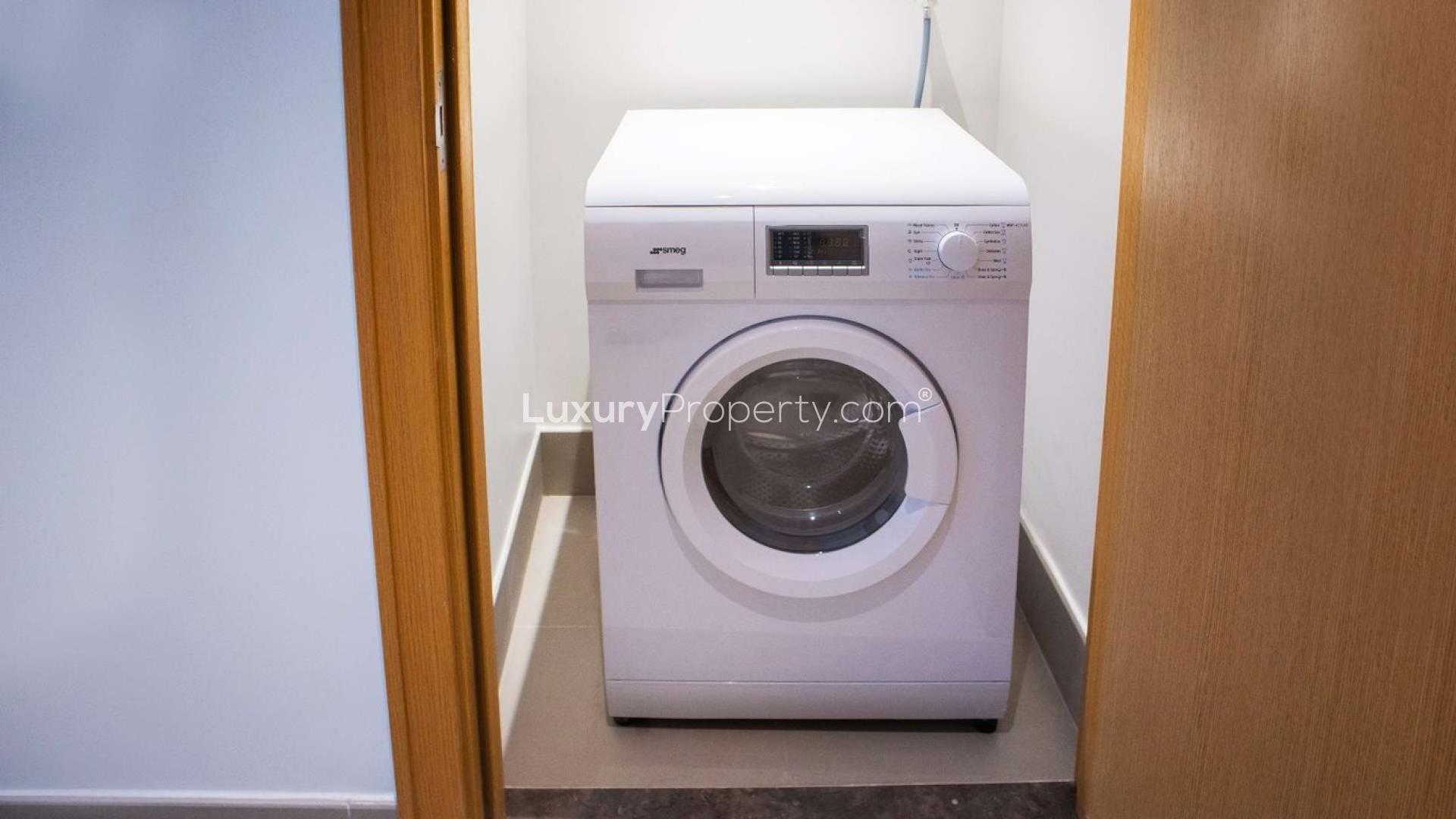 Spacious apartment interior with large windows, Burj Khalifa view, Downtown Dubai location