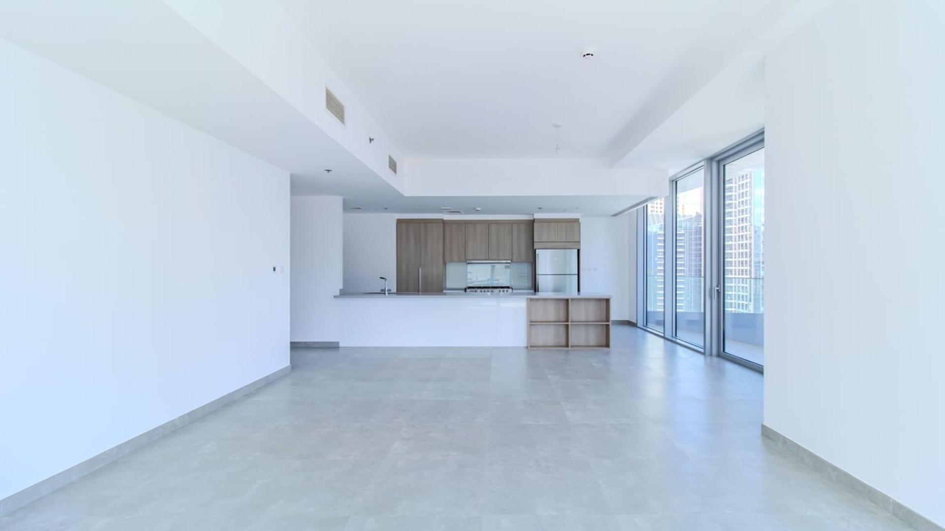 Open-plan kitchen in luxury apartment, Stella Maris, Dubai Marina, with modern finishes and sea view