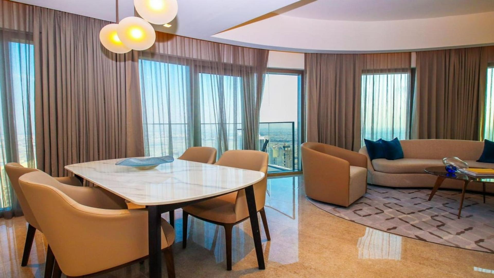 Fully furnished living room in Dubai Creek Harbour apartment with sea view, Address Harbour Point