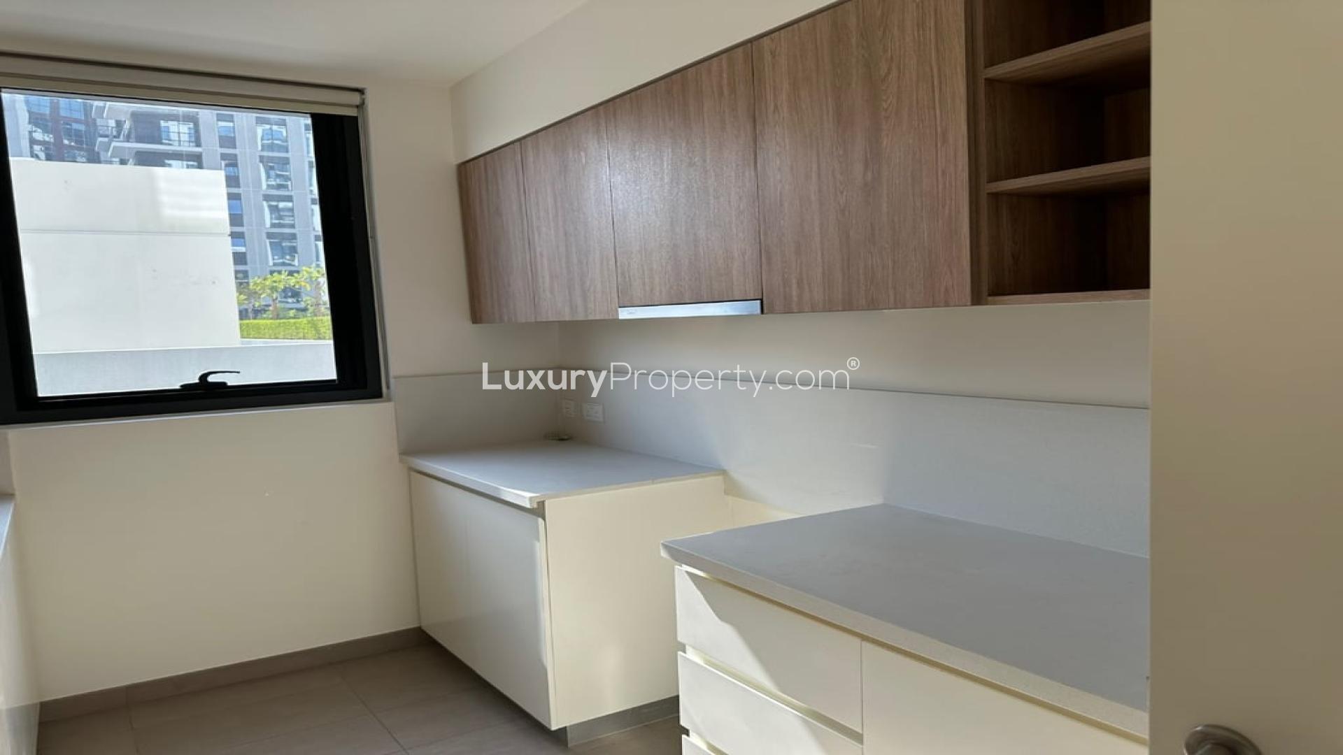 Spacious park-facing living room in vacant Dubai Hills Estate apartment for rent, Executive Residences