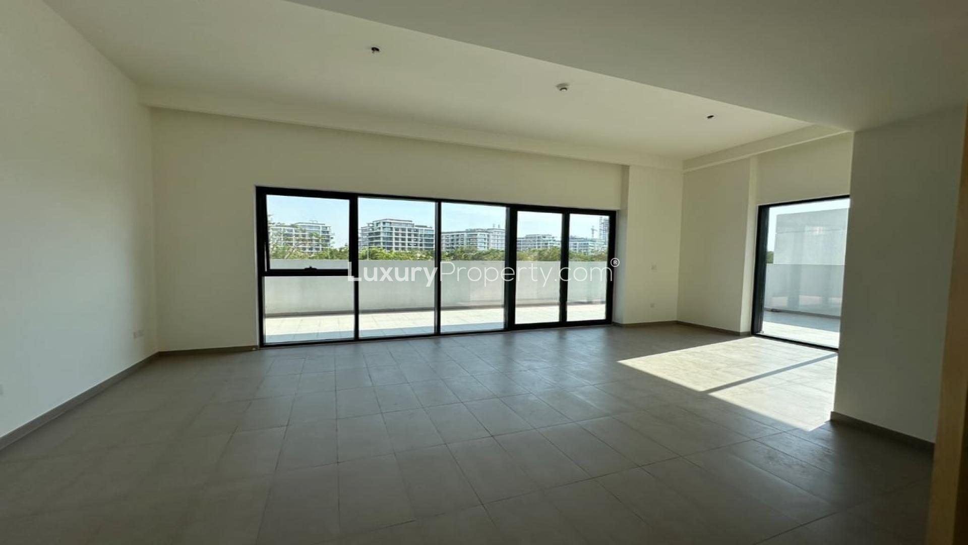 Spacious, sunlit living area in vacant Dubai Hills Estate apartment, park-facing with large windows