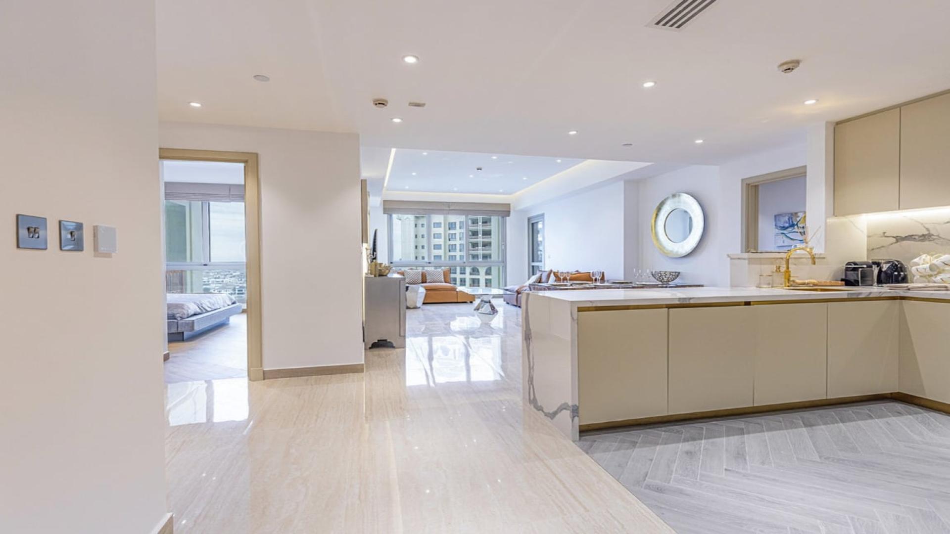 Furnished living room in Marina Residences apartment, featuring modern decor and custom upgrades