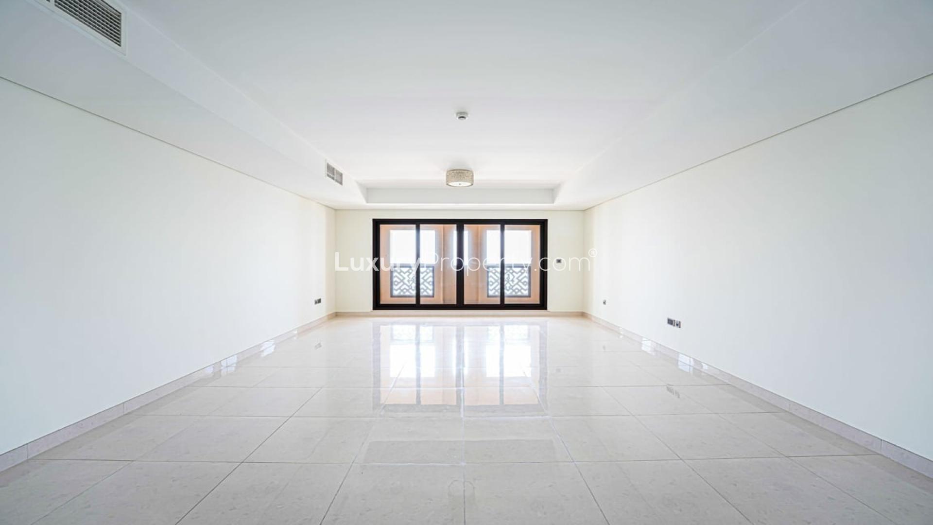 Spacious living room with large windows in Palm Jumeirah apartment, Kingdom of Sheba
