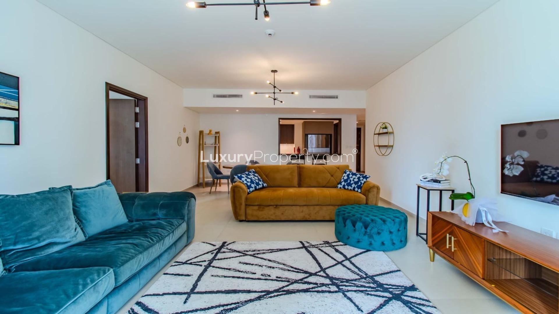 Modern living room in BLVD Heights apartment, Downtown Dubai, with balcony view and stylish decor