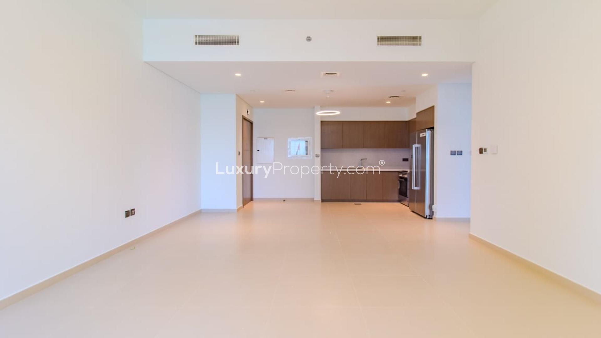 Modern apartment in Downtown Dubai with city views through large windows, featuring elegant lighting