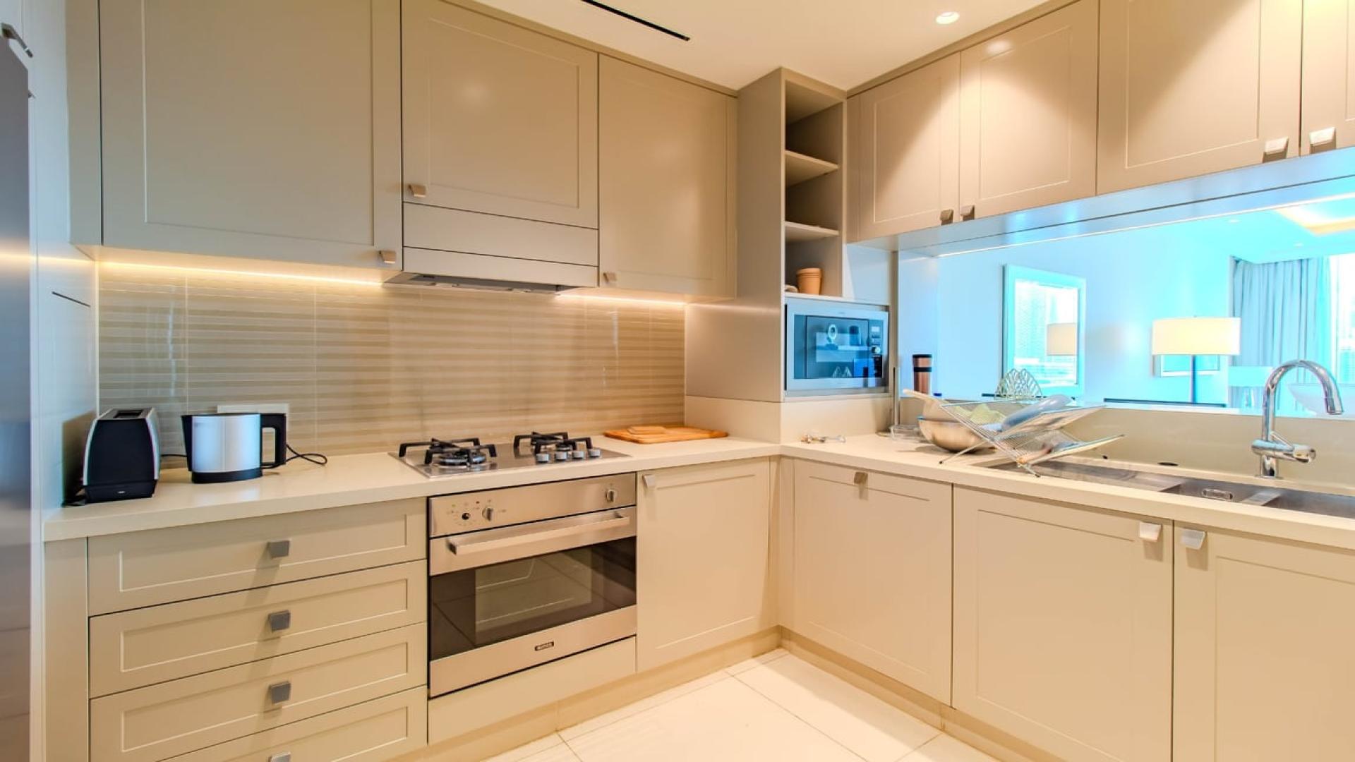 Spacious dining and living area with Burj Khalifa view in Downtown Dubai apartment