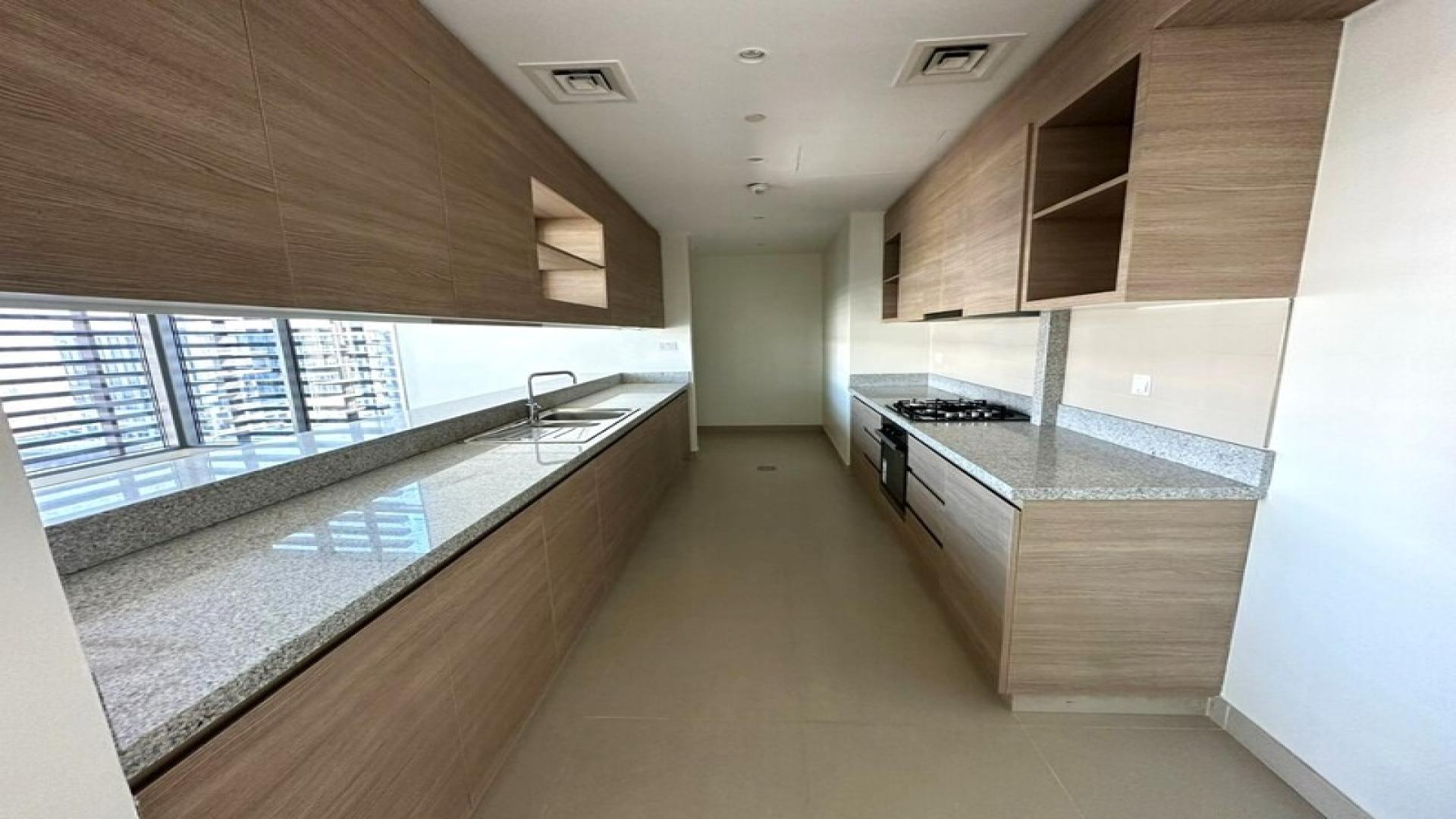 Bright open kitchen and living area in Park Heights apartment, Dubai Hills Estate