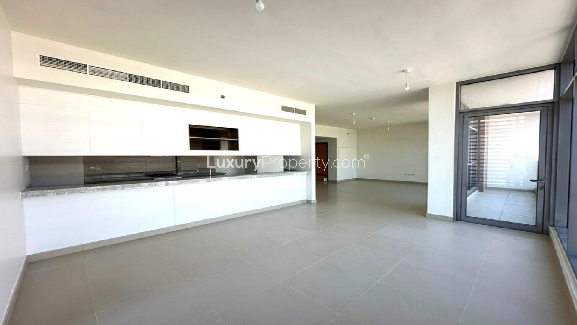 Vacant bright open apartment interior in Park Heights, Dubai Hills Estate, with large windows