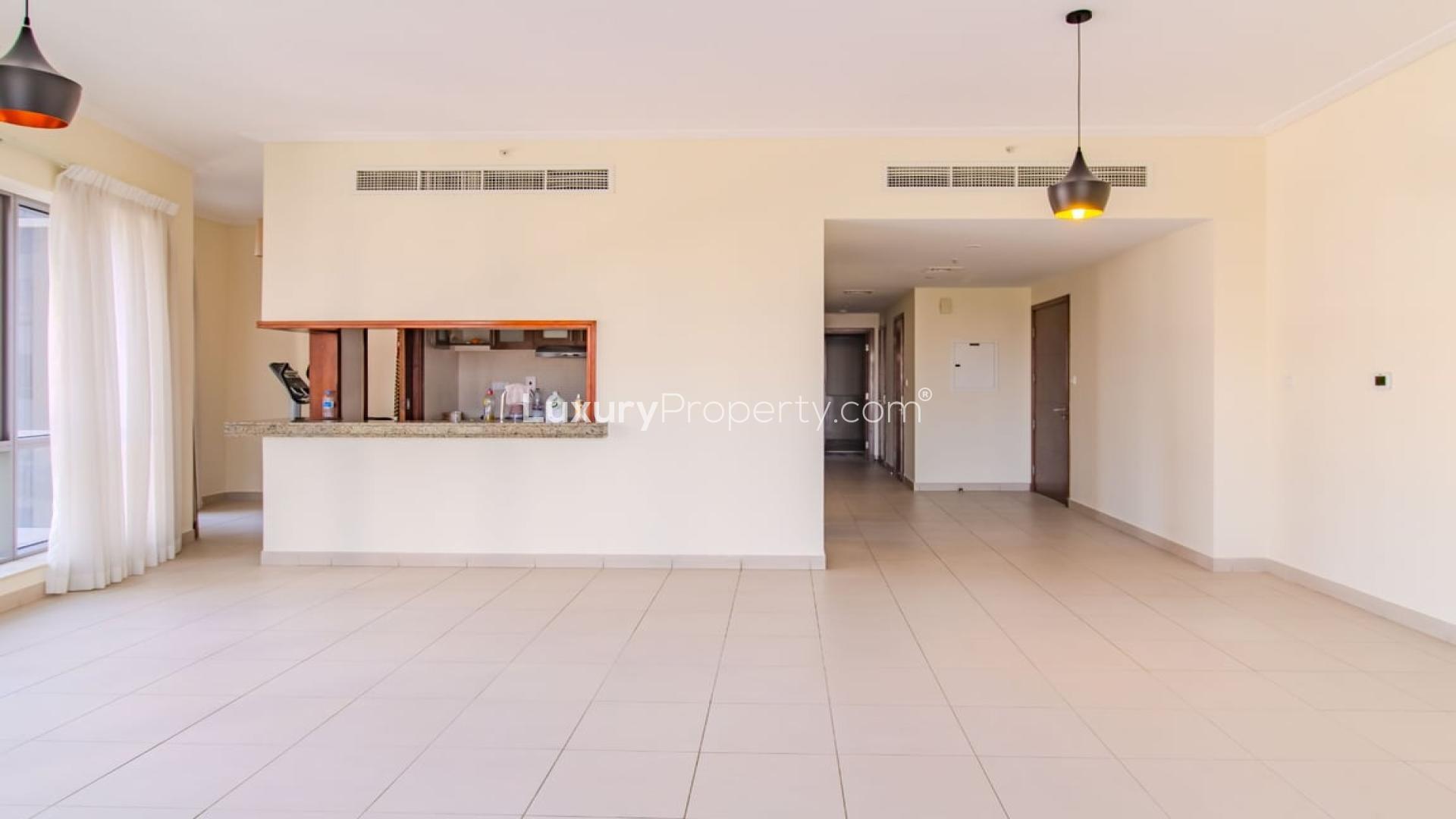 Spacious living room with large windows in South Ridge apartment, Downtown Dubai