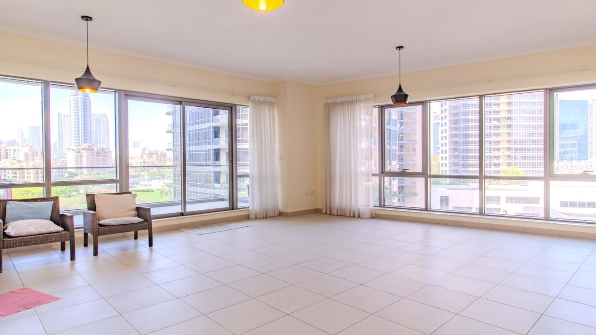 Spacious living area with large windows in Downtown Dubai apartment for rent, South Ridge