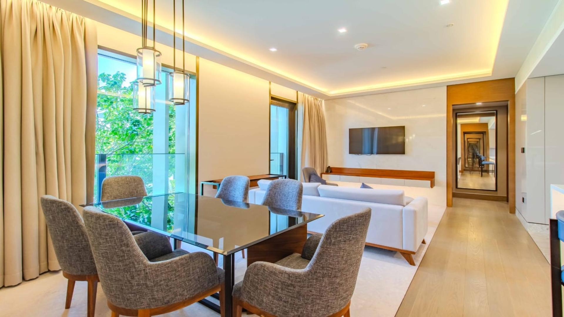 Modern living room in two-bedroom apartment at Caesars Bluewaters Dubai, featuring stylish decor