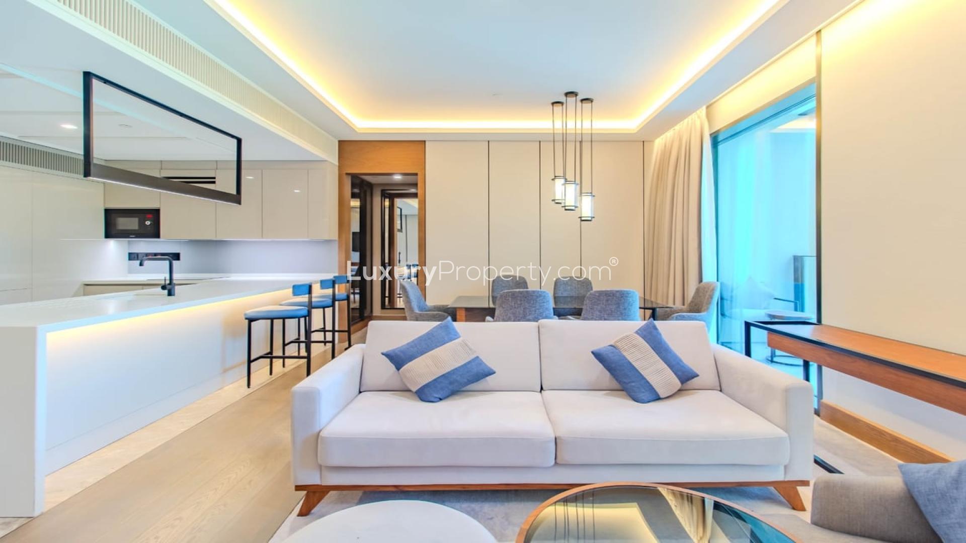 Modern living room in two-bedroom apartment, Caesars Bluewaters Dubai, featuring elegant furnishings