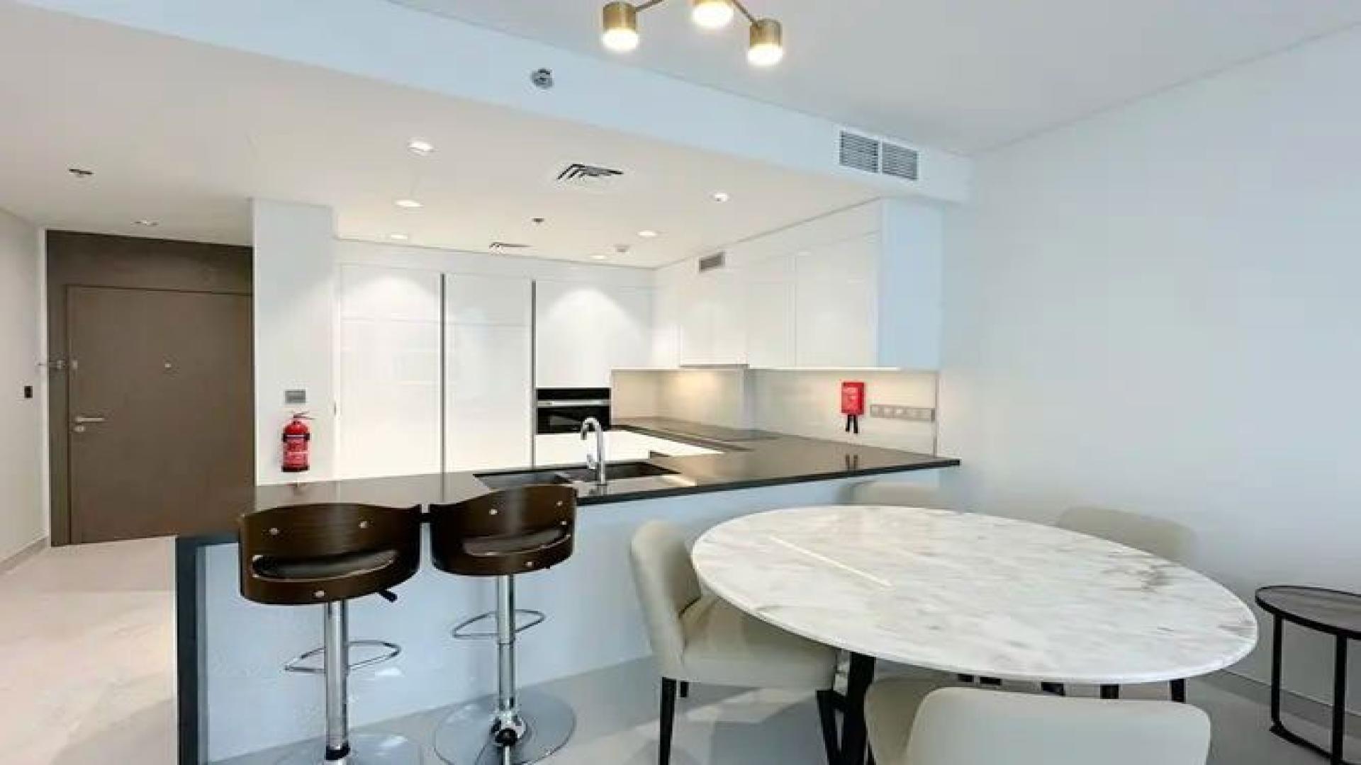 Furnished living room with modern decor in District One, Mohammed Bin Rashid City apartment