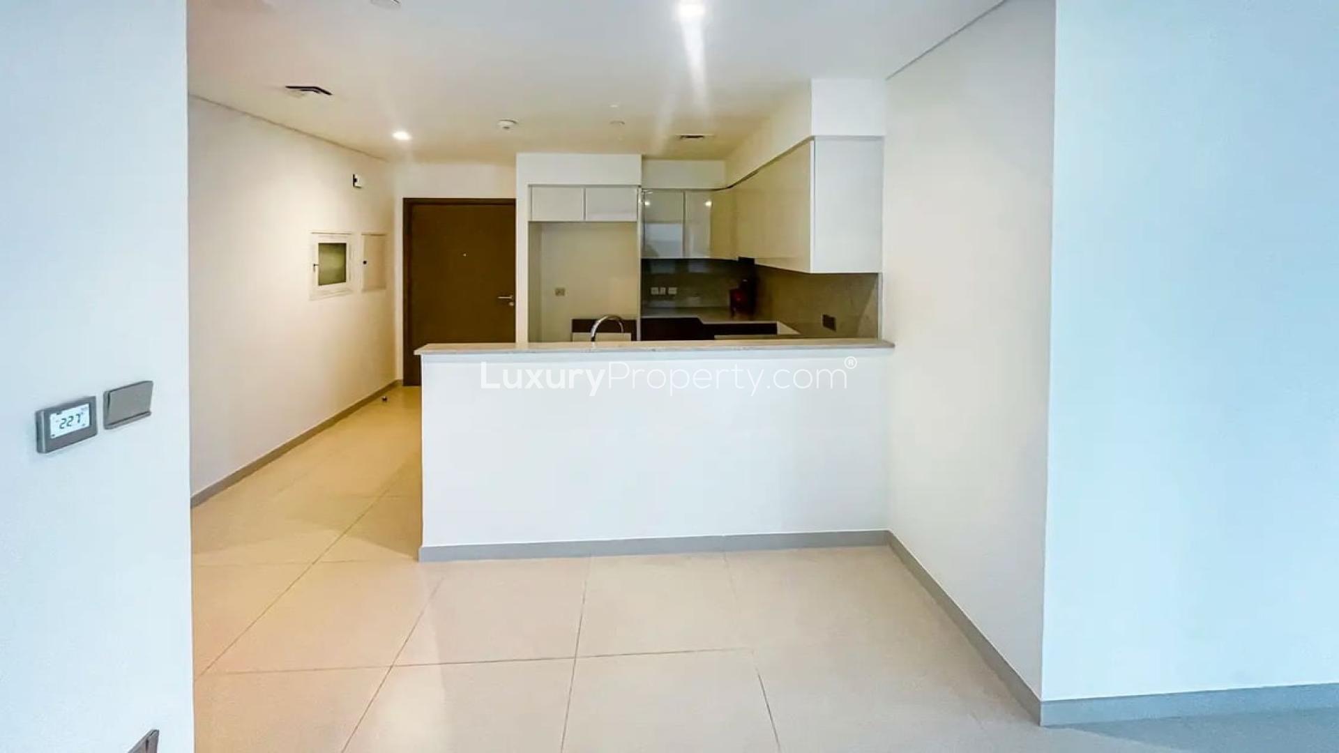 Spacious living area with large windows in Burj Royale apartment, Downtown Dubai