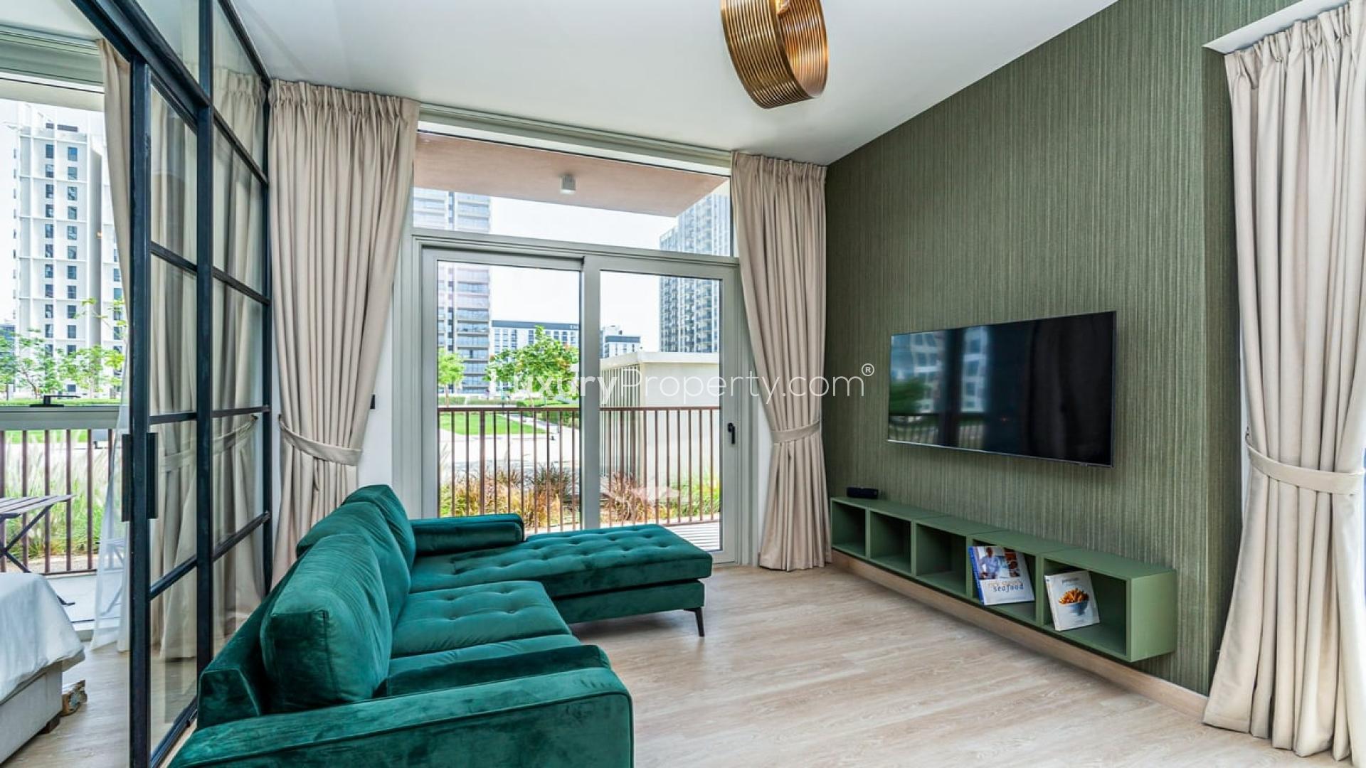 Modern furnished apartment with open-plan kitchen and living room in Dubai Hills Estate