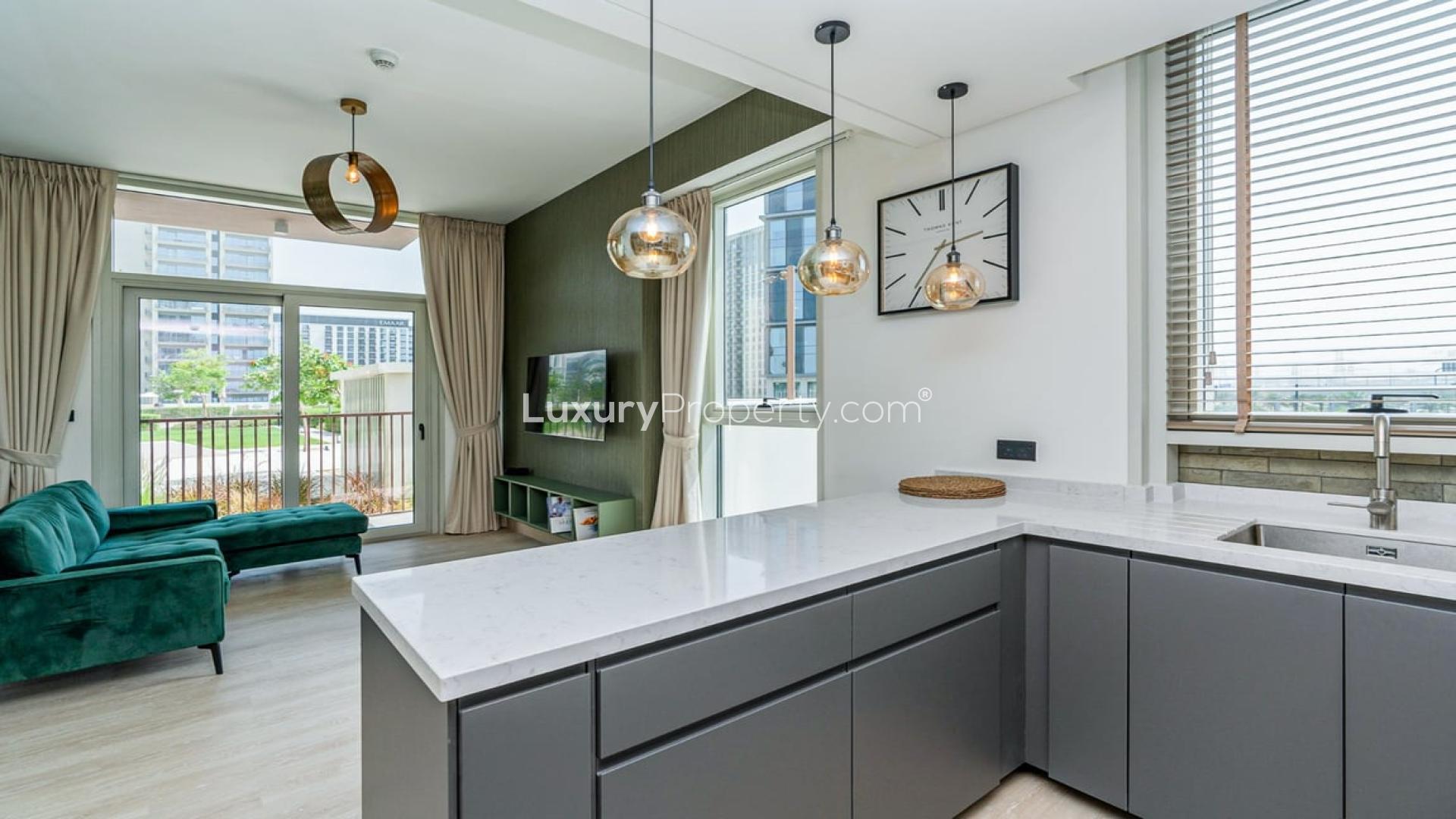 Modern kitchen in fully furnished Dubai Hills Estate apartment for rent, featuring sleek design