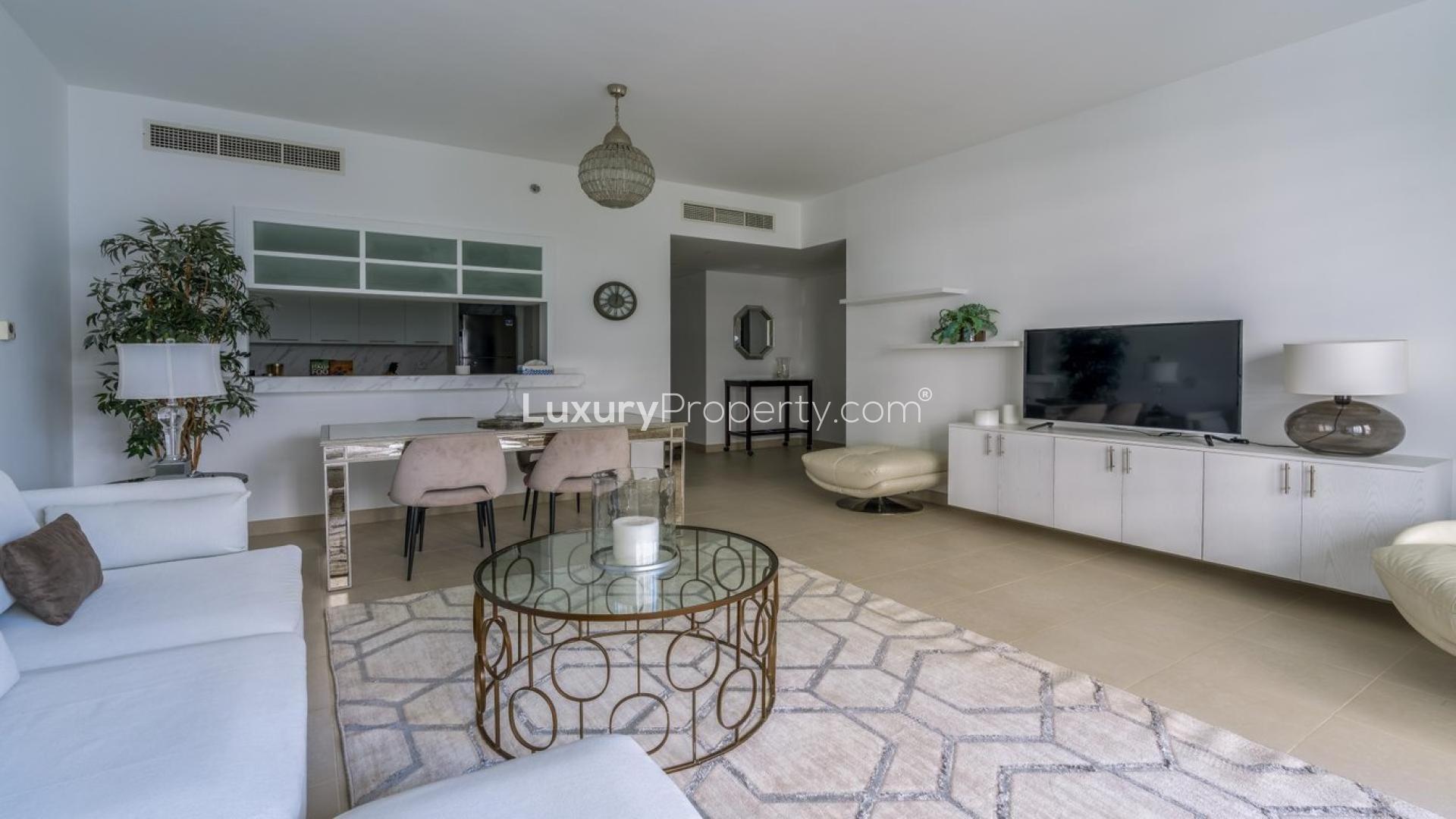 Fully furnished living room in Downtown Dubai apartment, featuring modern decor and open layout