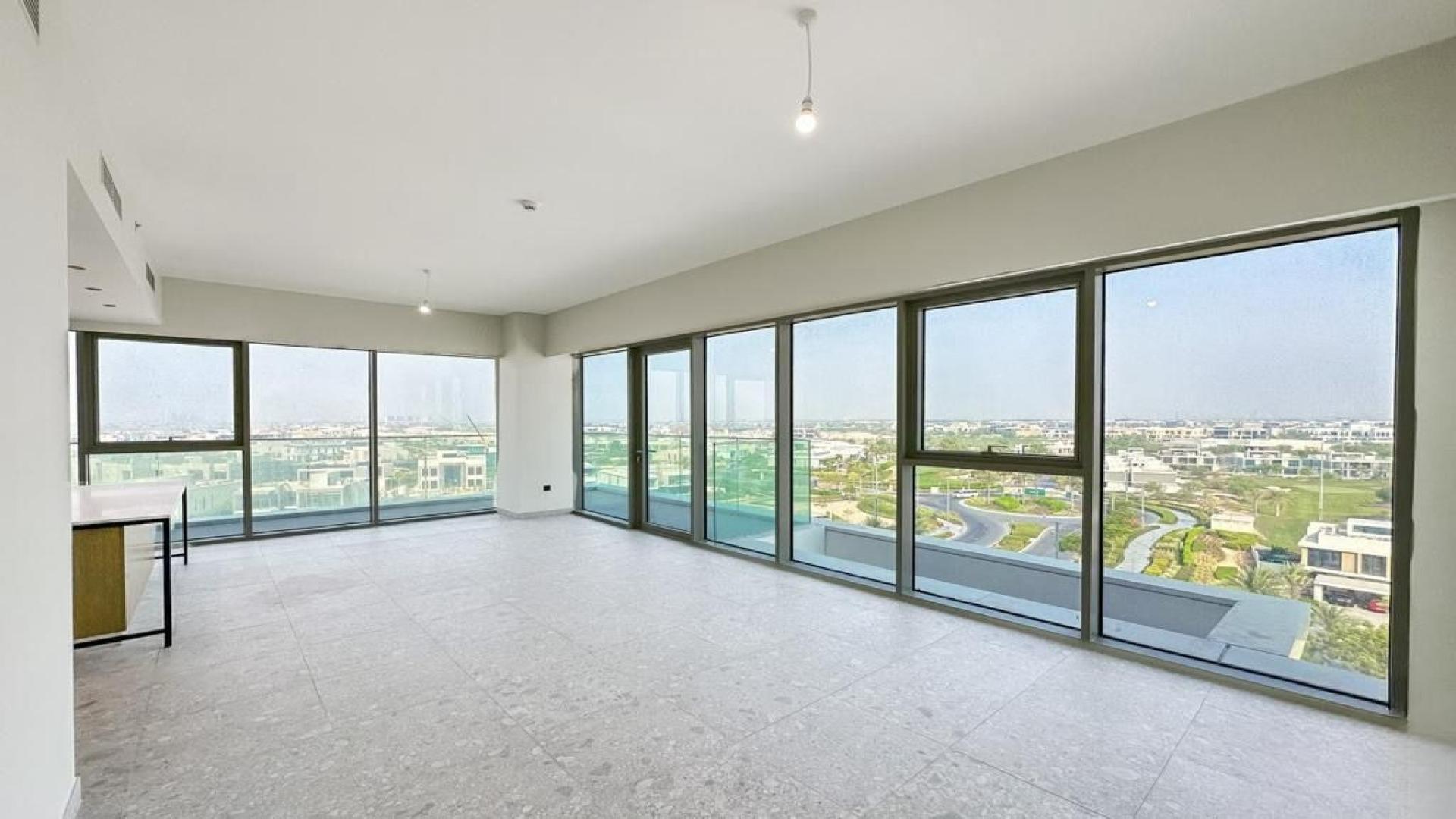 Dubai Hills Estate apartment balcony view overlooking golf course and community buildings