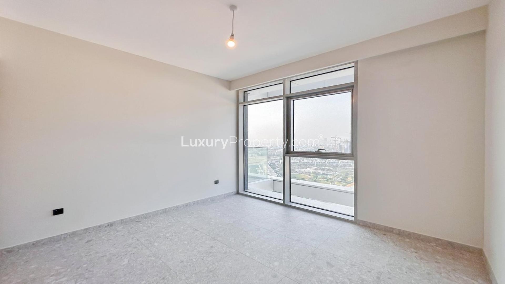 Bright open living area with golf course view in Dubai Hills Estate apartment