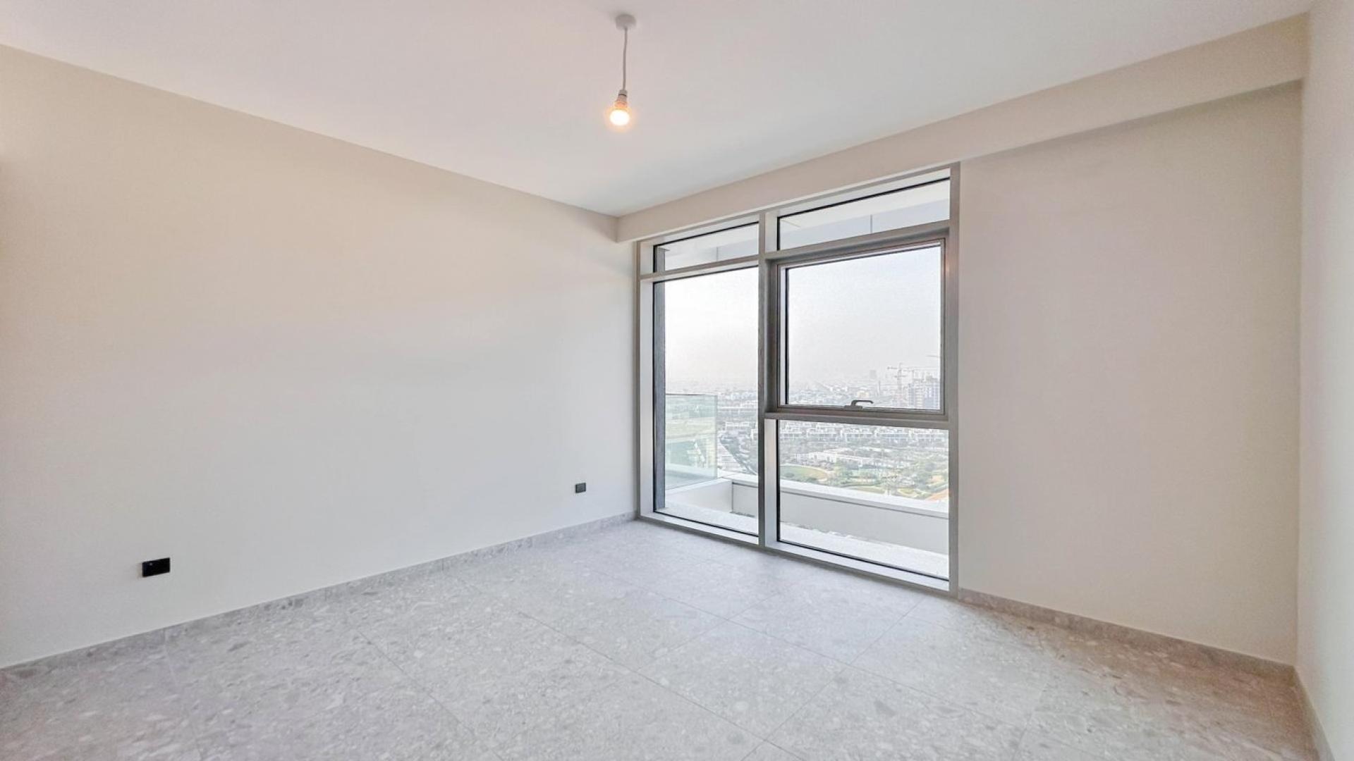 Bright open living area with golf course view in Dubai Hills Estate apartment