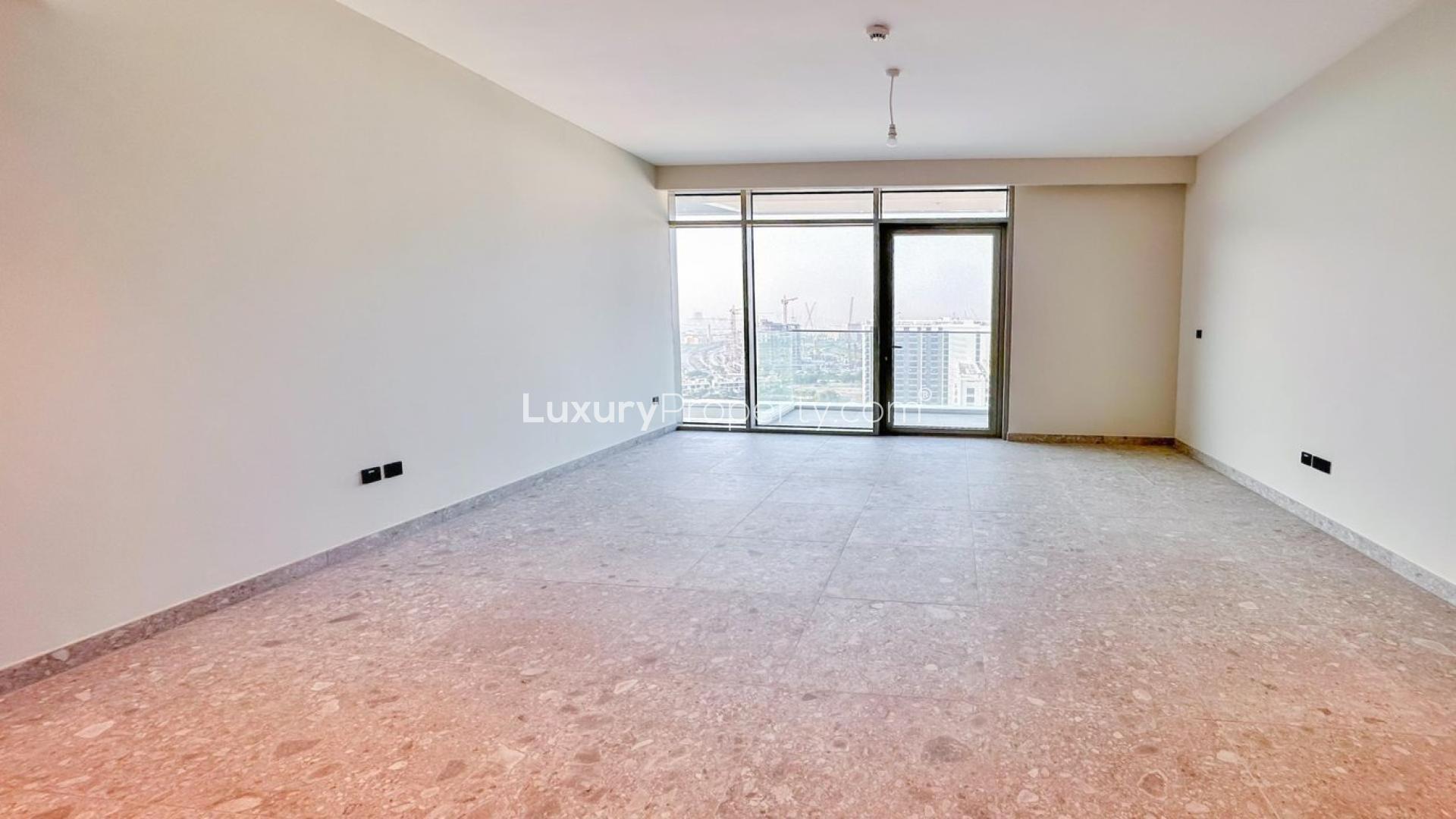 Modern kitchen in Dubai Hills Estate apartment with sleek cabinets and ample space