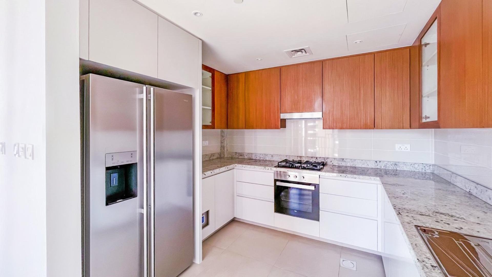 Bright living room with floor-to-ceiling windows in BLVD Heights, Downtown Dubai apartment