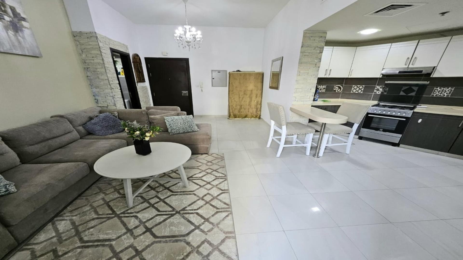 Fully furnished living room and kitchen in Dubai Silicon Oasis apartment for rent