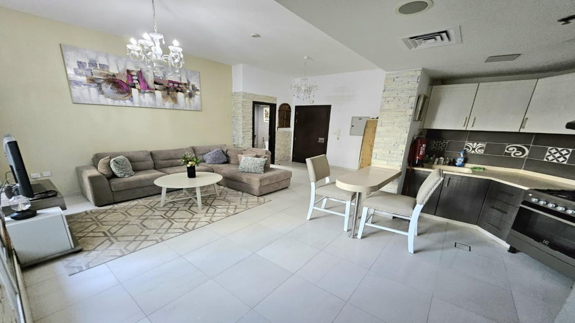 "Modern furnished living room and kitchen in Silicon Heights apartment, Dubai Silicon Oasis.",N/A,Modern kitchen with bar seating in fully furnished 2-bedroom apartment, Silicon Heights, Dubai Silicon Oasis