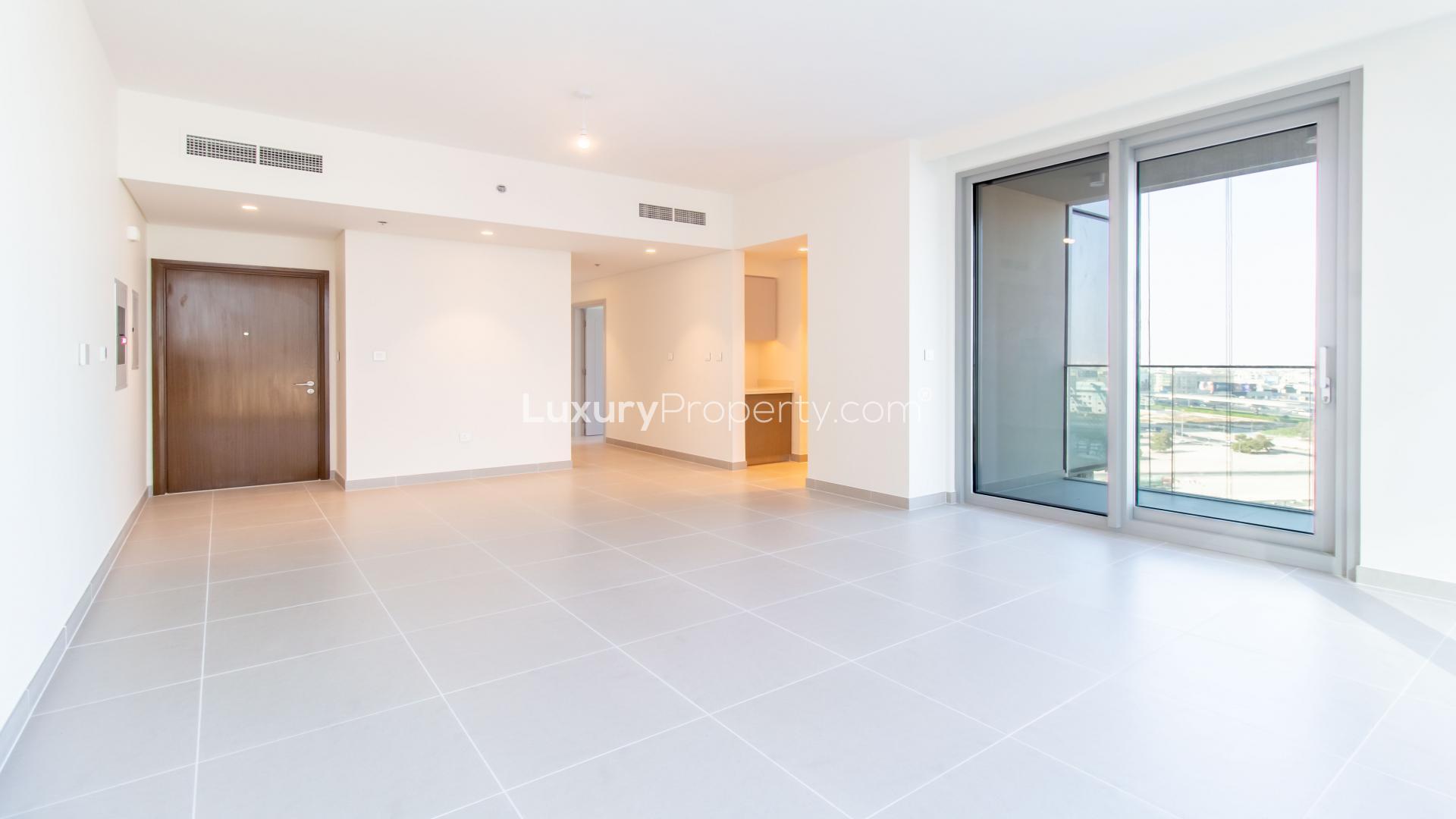 Modern living room with large windows in two-bedroom apartment, Forte, Downtown Dubai, for rent