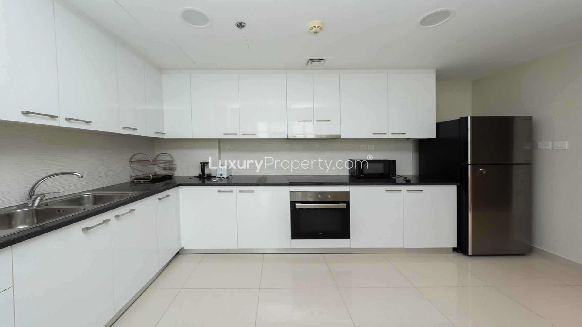 Furnished 2-bedroom apartment in Al Sufouh 1, modern living room and kitchen area