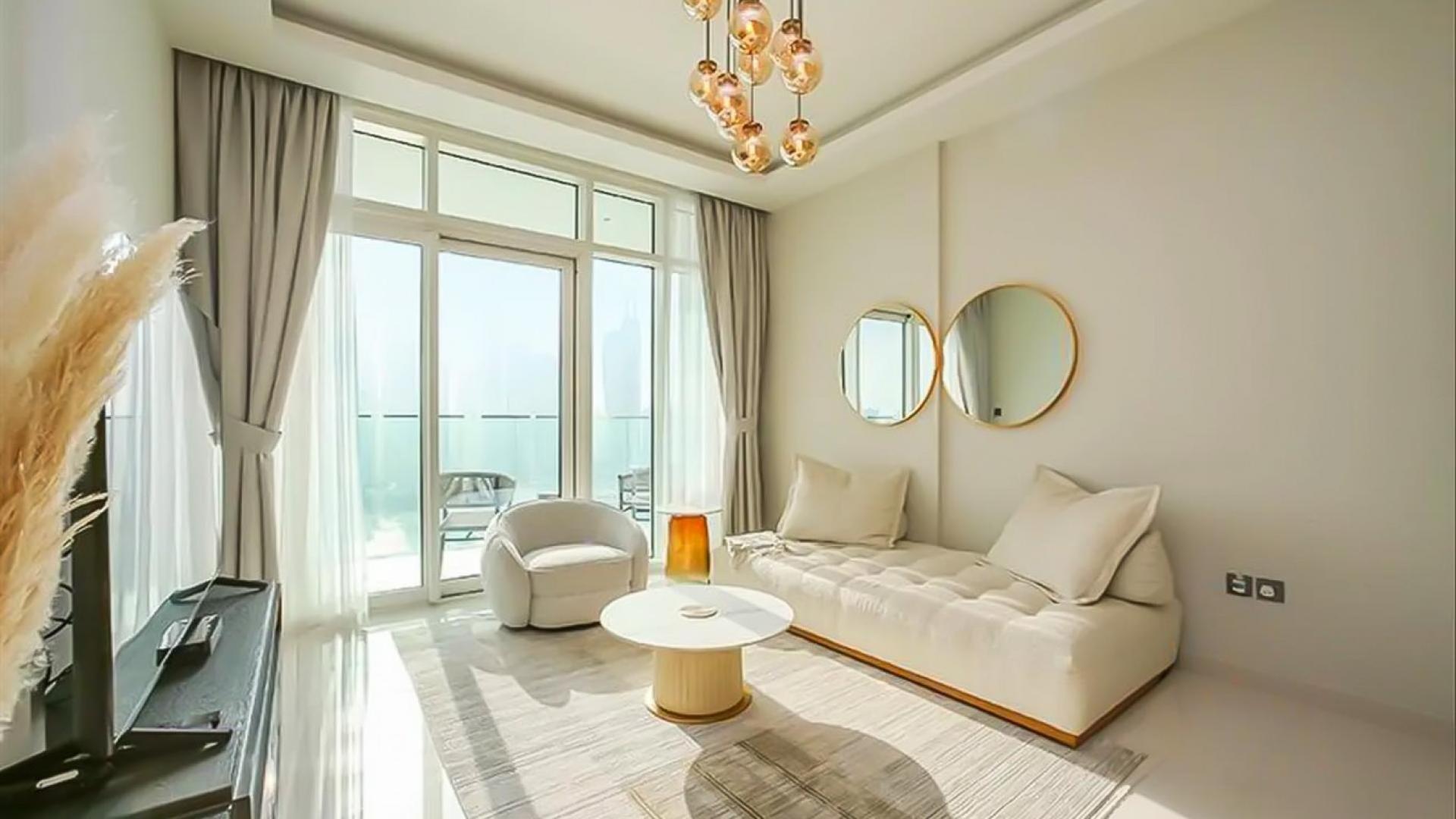 Modern living room with elegant decor in Emaar Beachfront apartment, Dubai Harbour