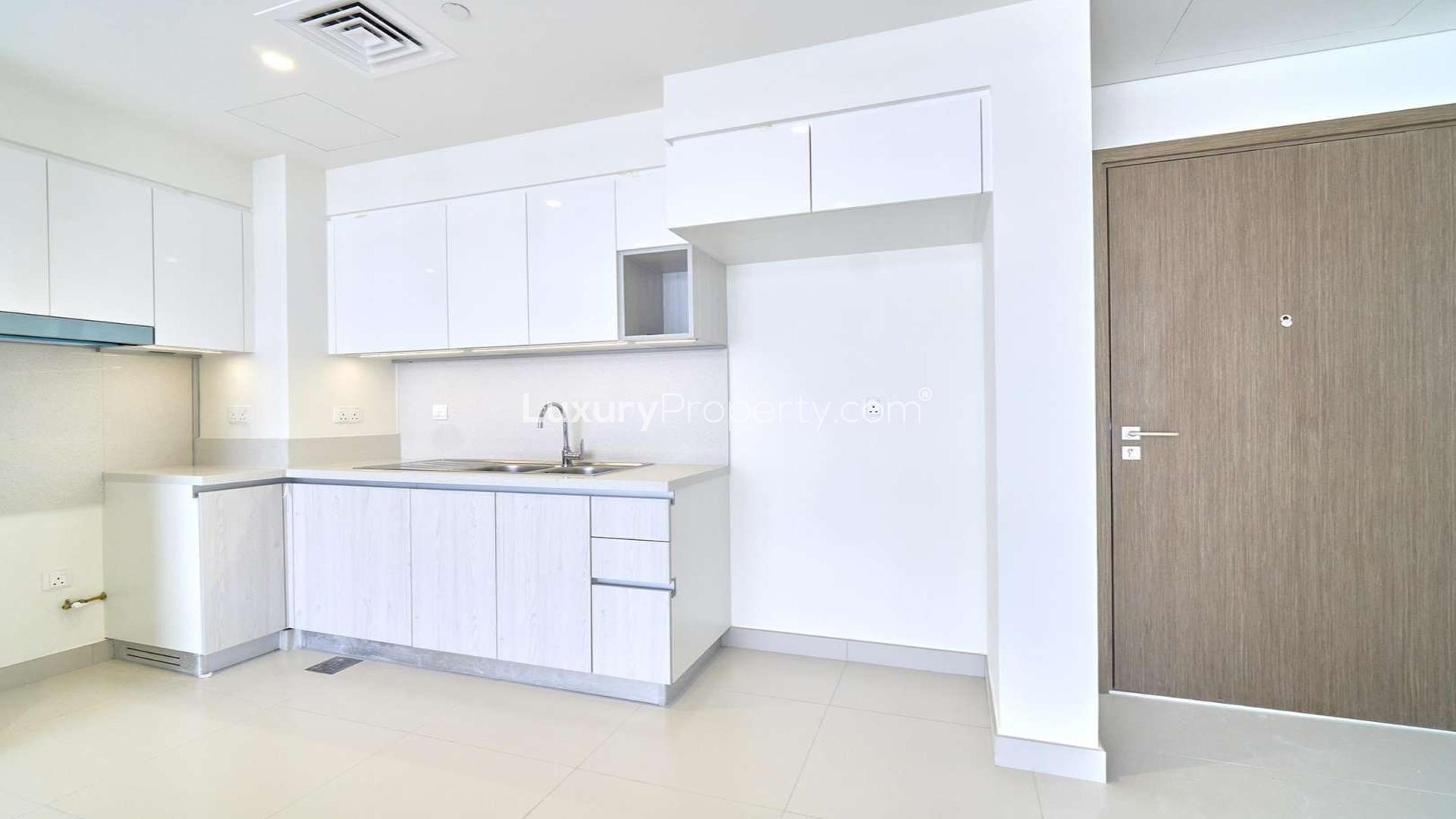 Spacious living area with large windows in Park Point, Dubai Hills Estate apartment for rent