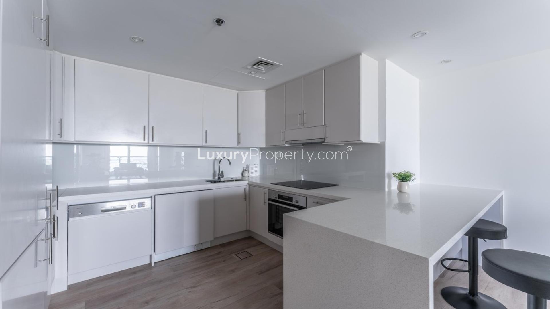 Modern kitchen in 2-bedroom apartment, Princess Tower, Dubai Marina, with sleek white cabinets