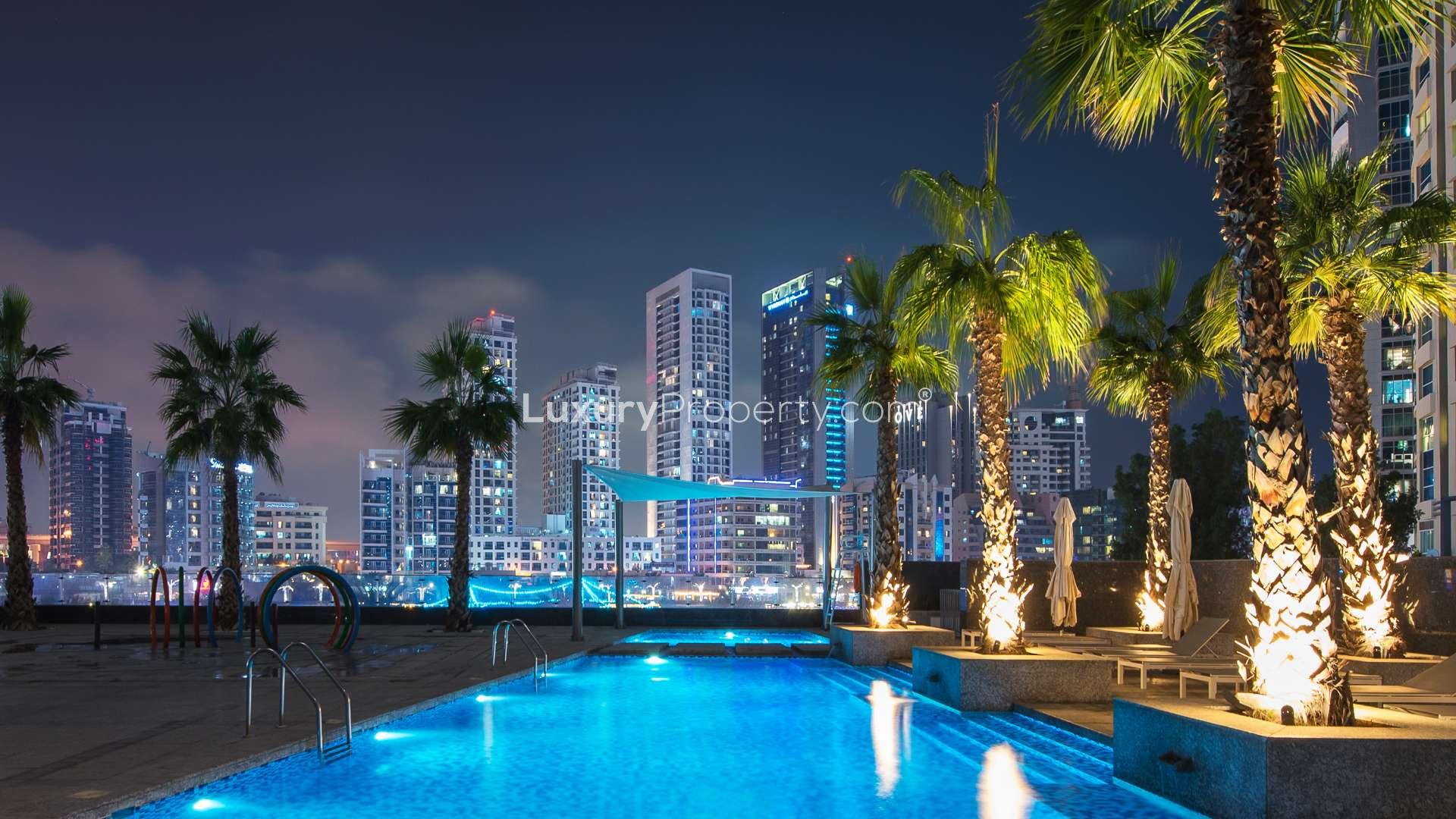 Night view of Jumeirah Beach Residence skyline with waterfront, showcasing vibrant city lights