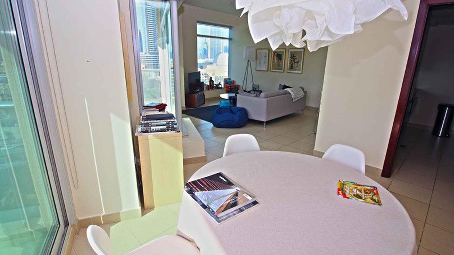 Living room in two-bedroom apartment, Burj Views, Downtown Dubai, bright modern space for sale