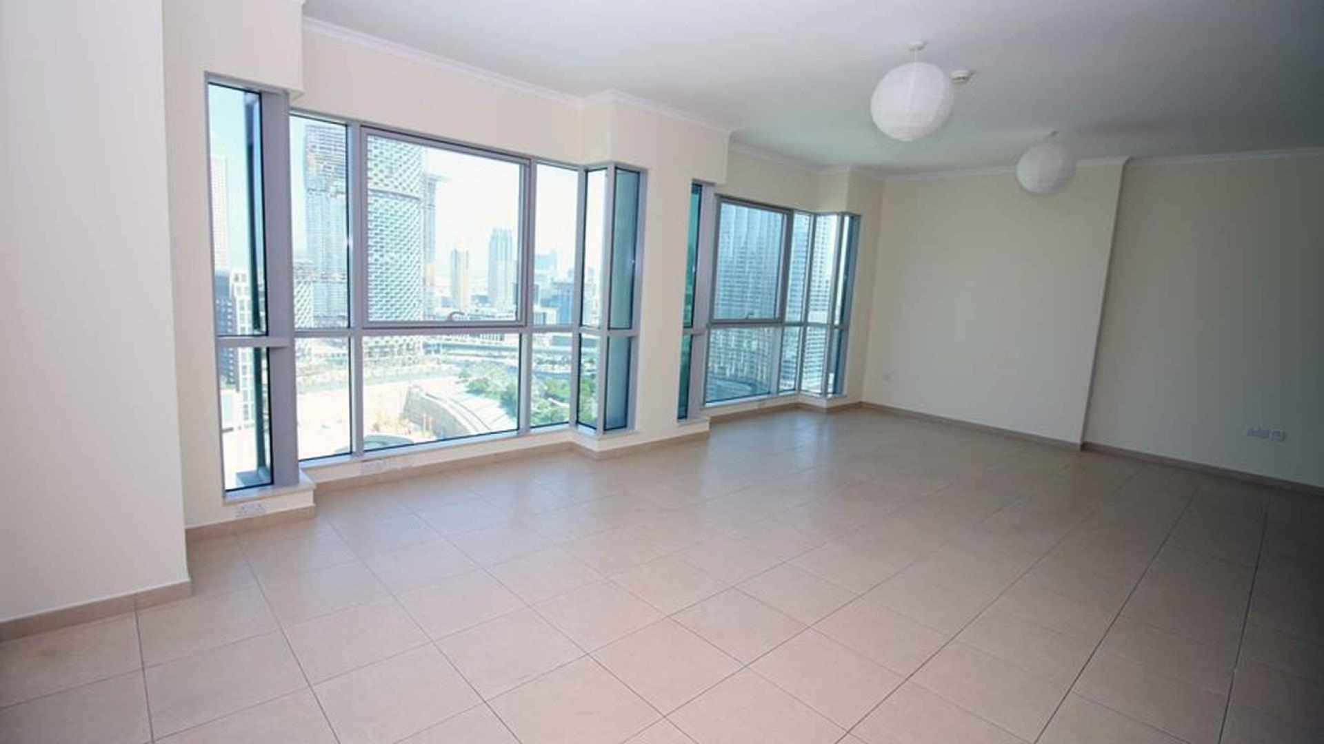 Bright, spacious living room with city views in Downtown Dubai apartment for sale