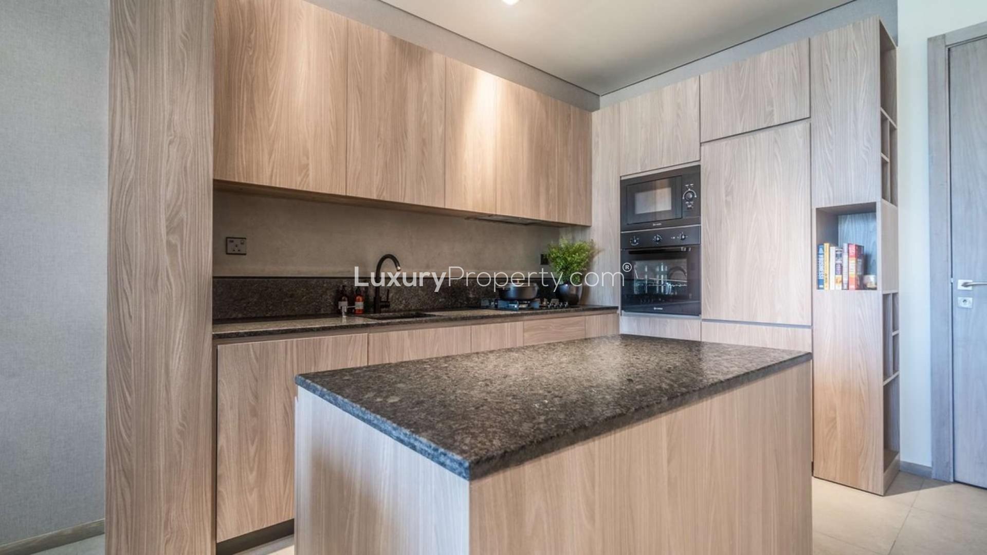 Contemporary living room in Signature Livings studio, Jumeirah Village Circle, with city view